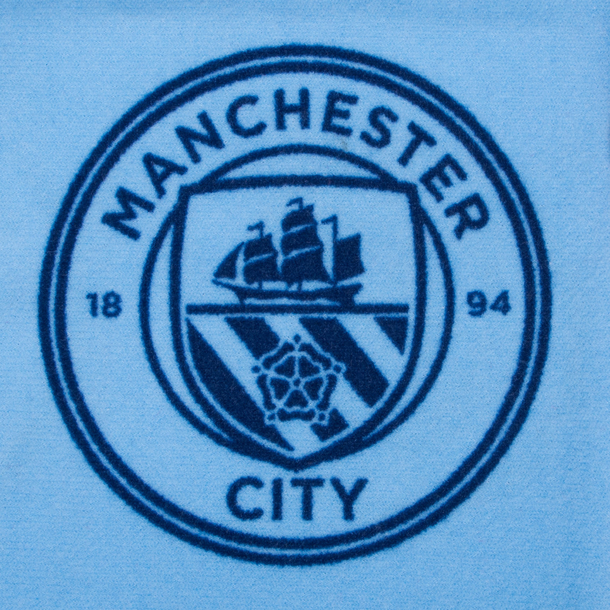 Manchester City kids loungewear pyjama set. Short sleeve t-shirt in white with Man City crest to chest. Long pants in sky blue with all-over print of the club crest