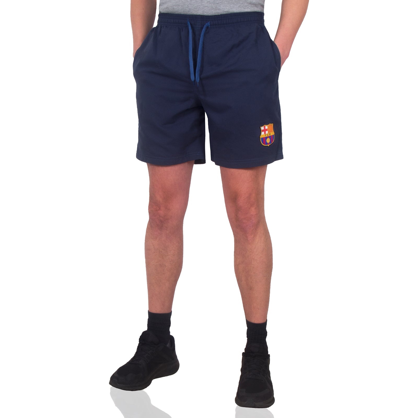 FC Barcelona adults fleece shorts in navy blue with crest to left leg and pockets to front & back.