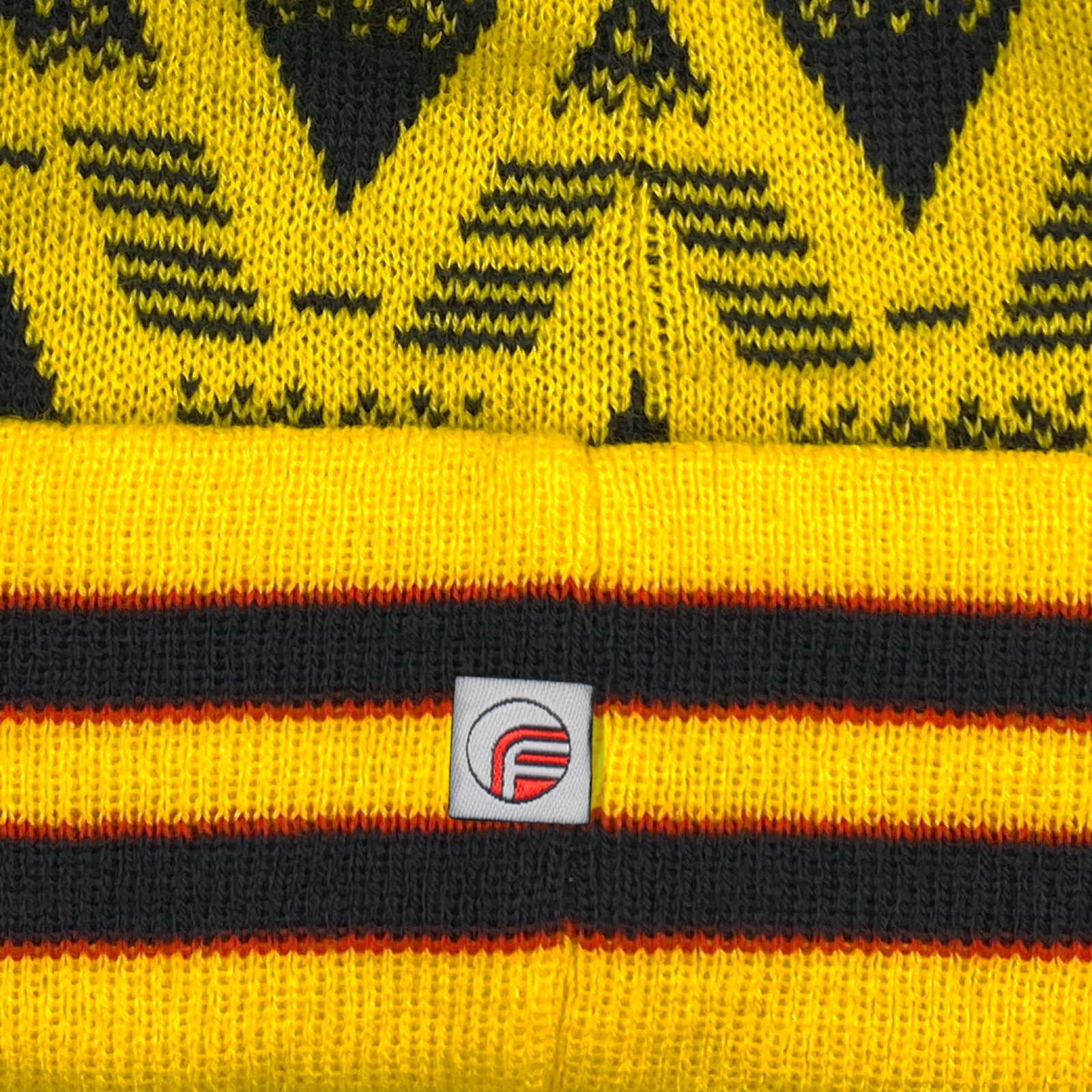 Arsenal retro knitted bobble hat in yellow with text to front