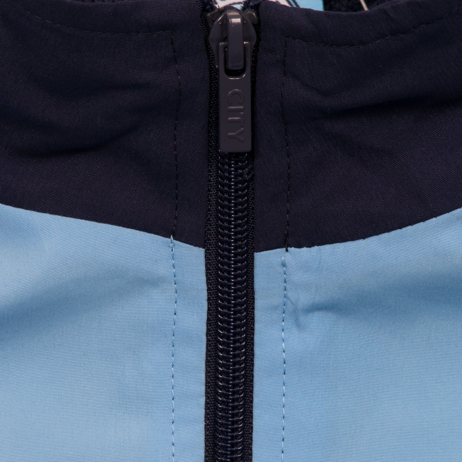 Man City adults tracksuit in navy blue with club crest to chest and left thigh