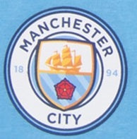 Man City kids pyjamas in navy blue. Short sleeve top with graphic and shorts with crest to the left leg