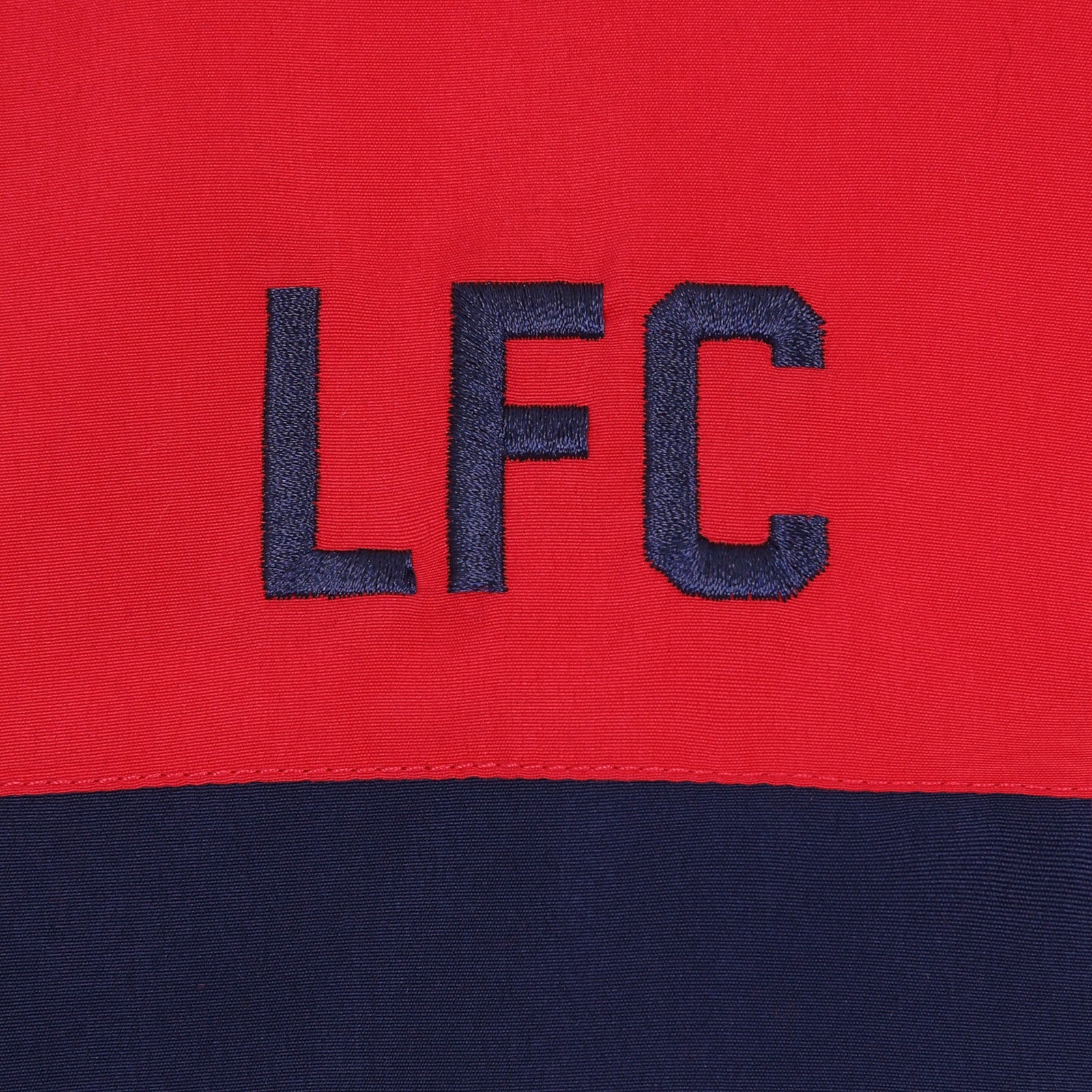Liverpool kids tracksuit in navy blue with club crest to chest and left thigh