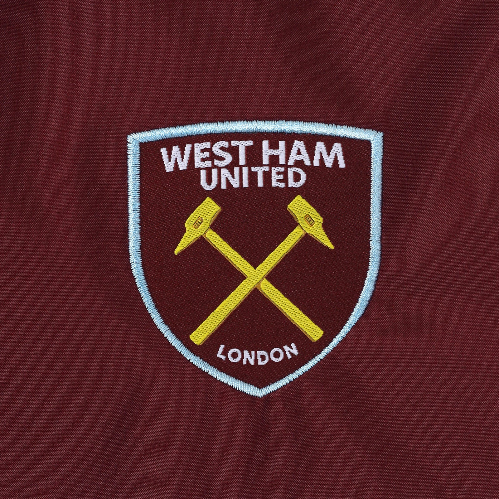 West Ham adults shower jacket in navy with club crest and pockets to front