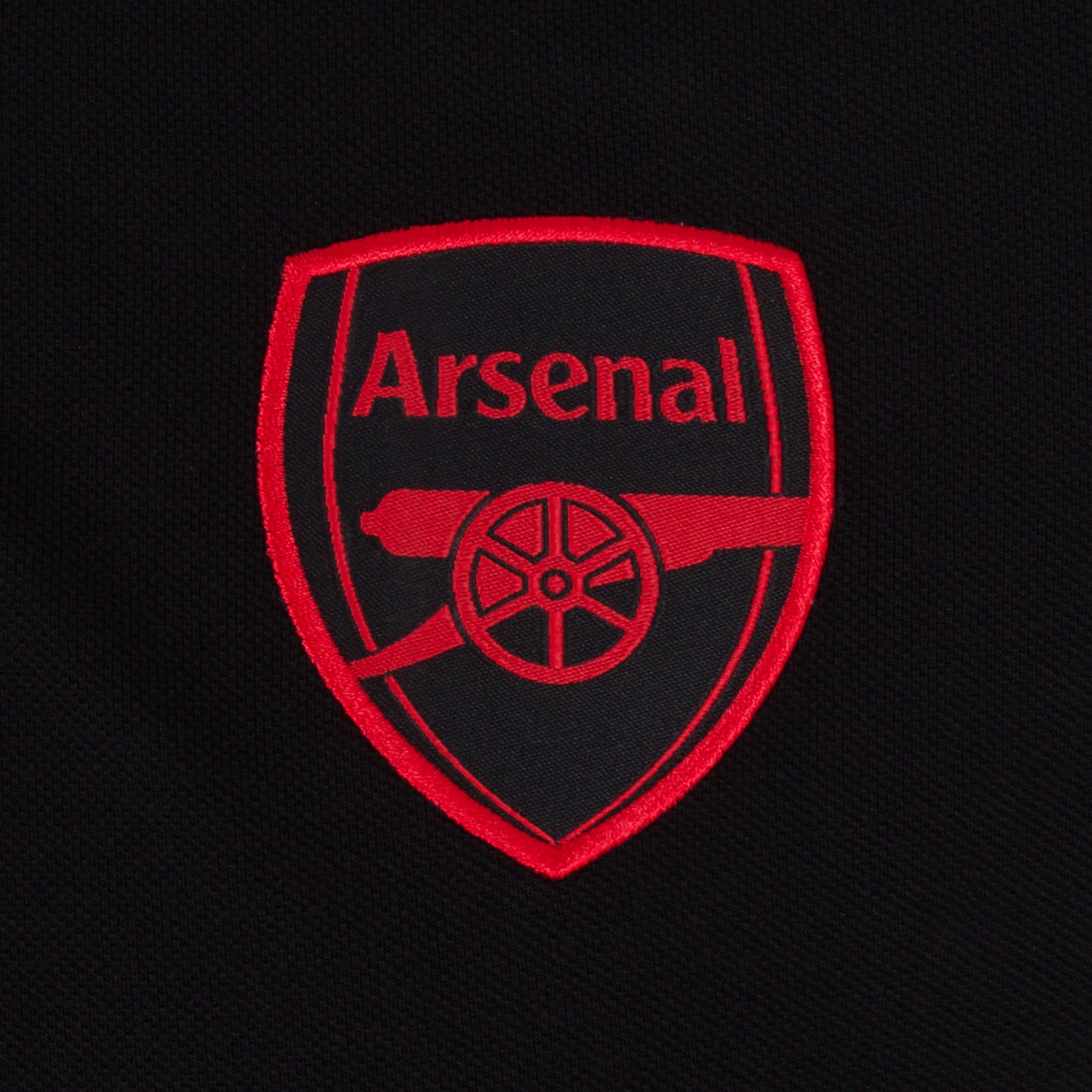 Arsenal polo shirt for adults in black with contrast sleeve, club crest and canon to chest.