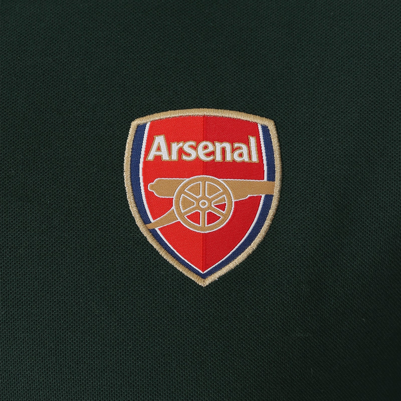 Arsenal polo shirt for adults in black with contrast sleeve, club crest and canon to chest.