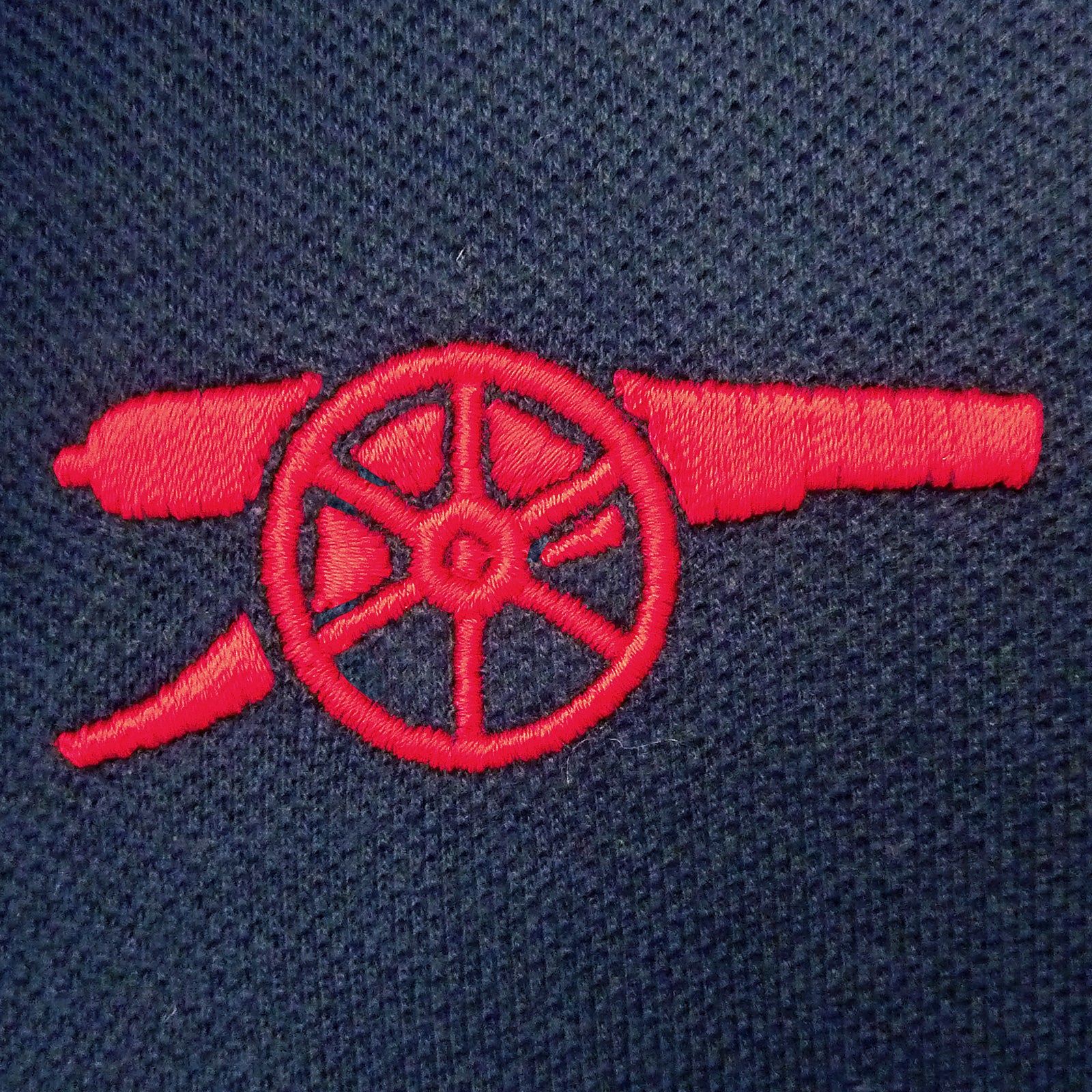 Arsenal polo shirt for adults in navy blue with club crest and canon to chest.