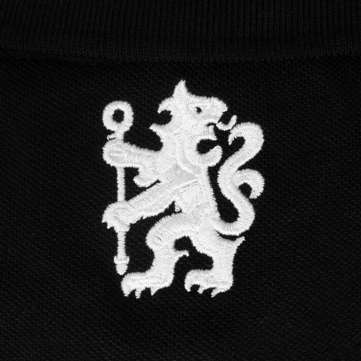 Chelsea adults polo shirt in black with crest and Chelsea FC text to chest