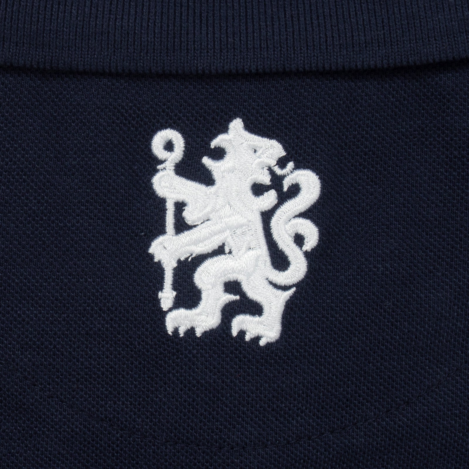 Chelsea adults polo shirt in navy with crest and Chelsea FC text to chest