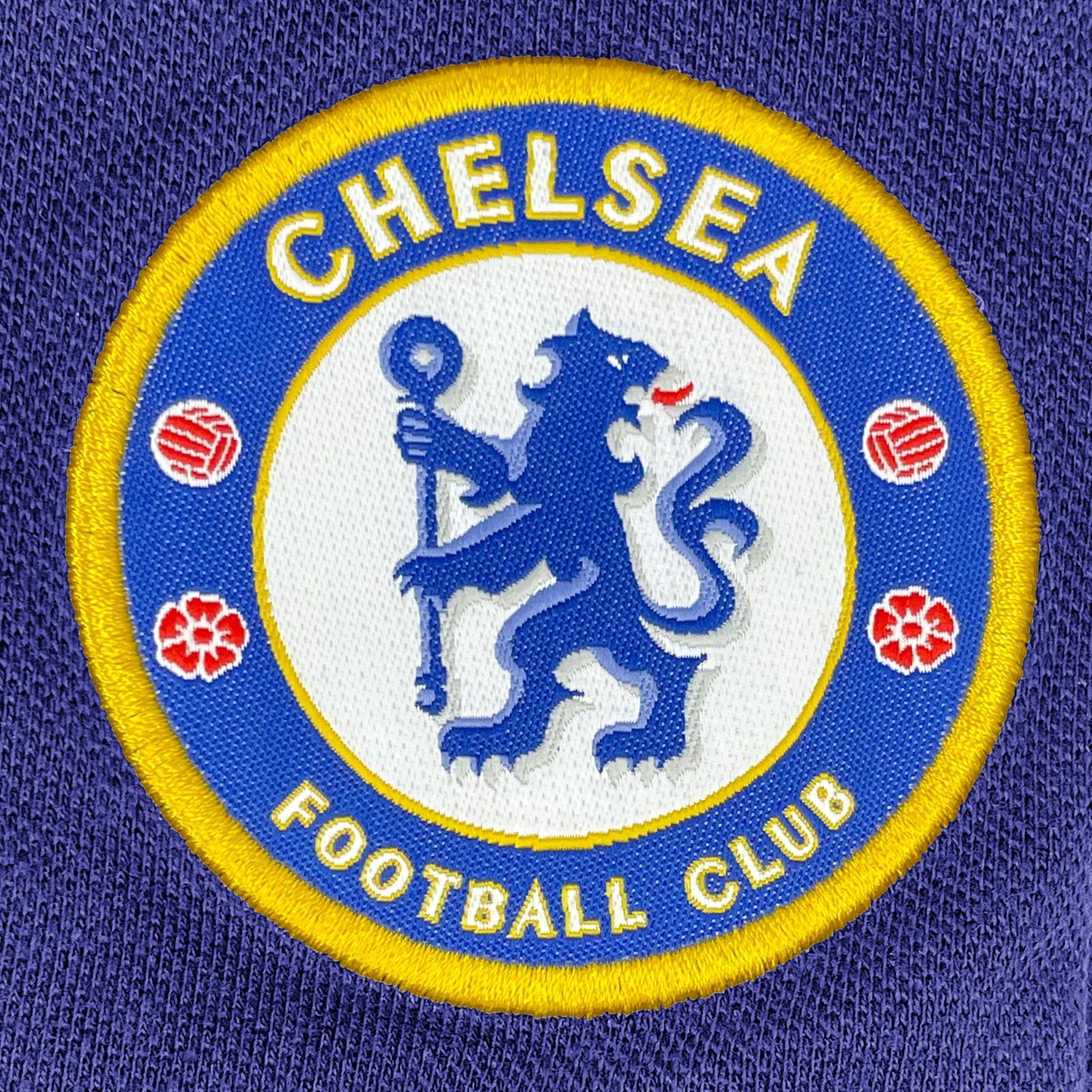 Chelsea adults polo shirt in royal blue with crest and Chelsea FC text to chest
