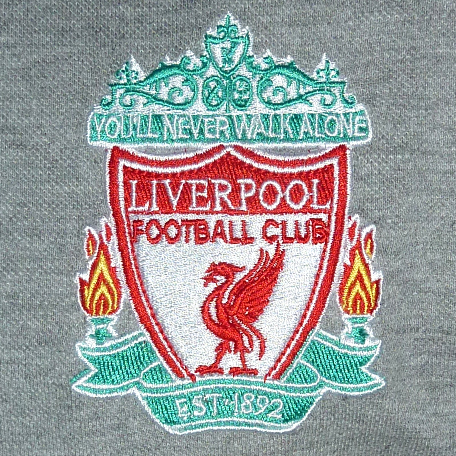 Liverpool adults polo shirt in grey with LFC badge and Liverpool FC text to chest.