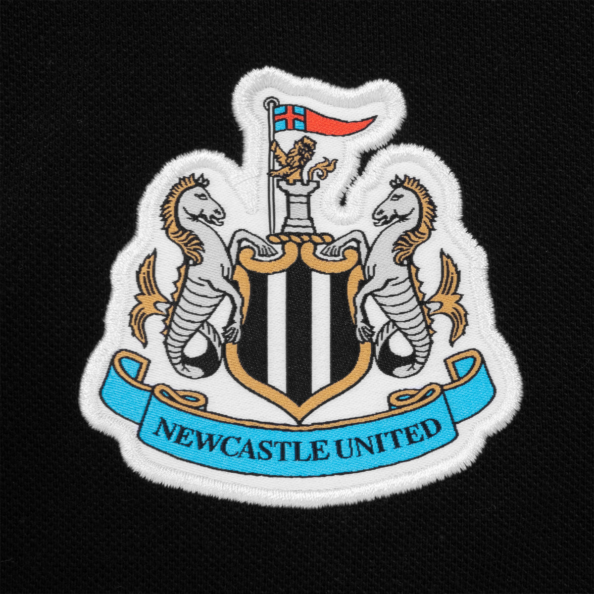 Newcastle Utd adults polo shirt in black with club crest to chest.
