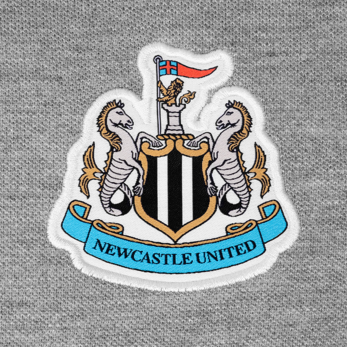 Newcastle Utd adults polo shirt in grey with NUFC badge and text to chest.