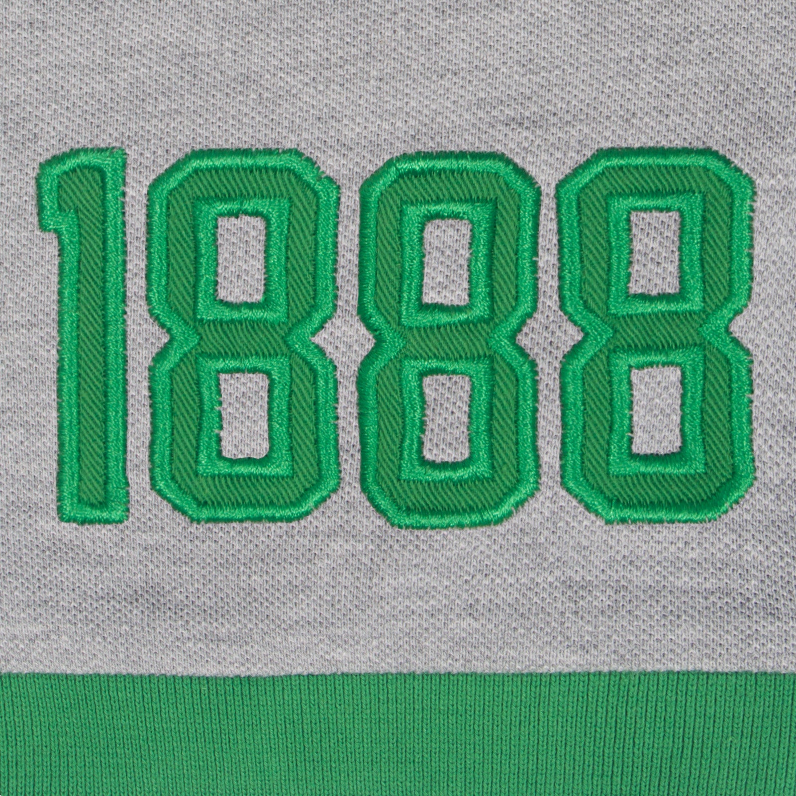 Celtic kids polo shirt in black with contrast sleeve and club crest to chest