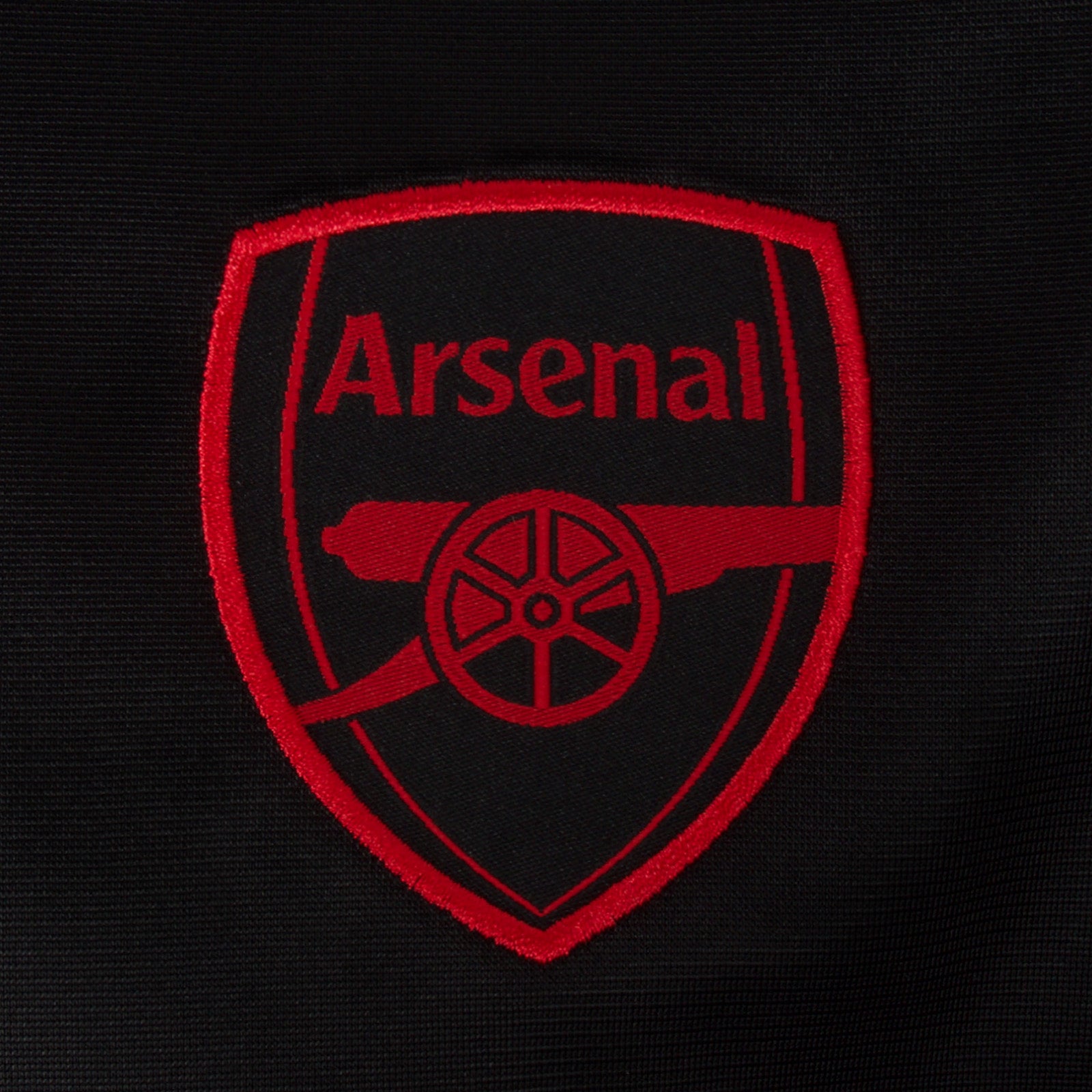 Arsenal adults retro track jacket in black with club crest to chest.