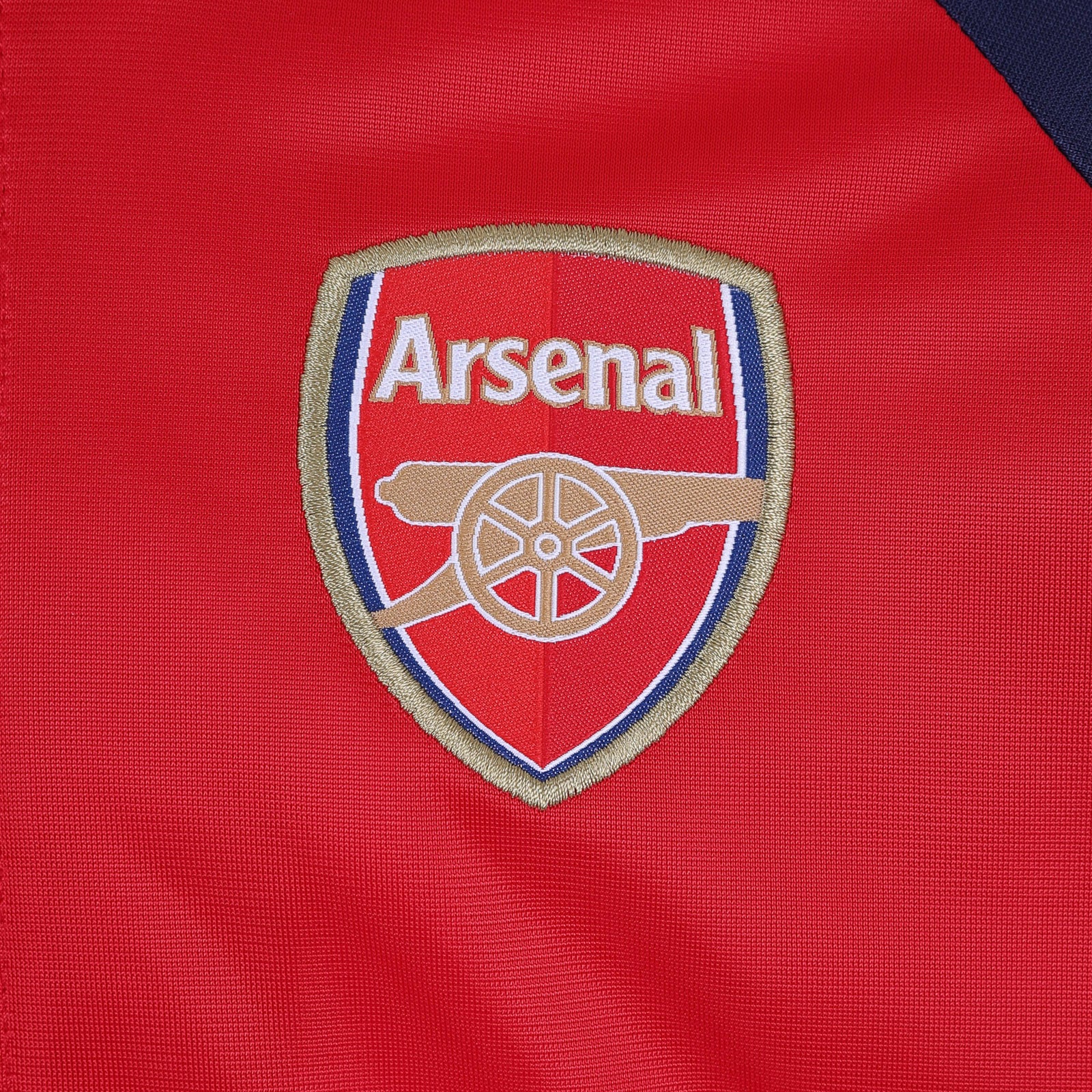 Arsenal kids retro track jacket in red and navy with club crest to chest.