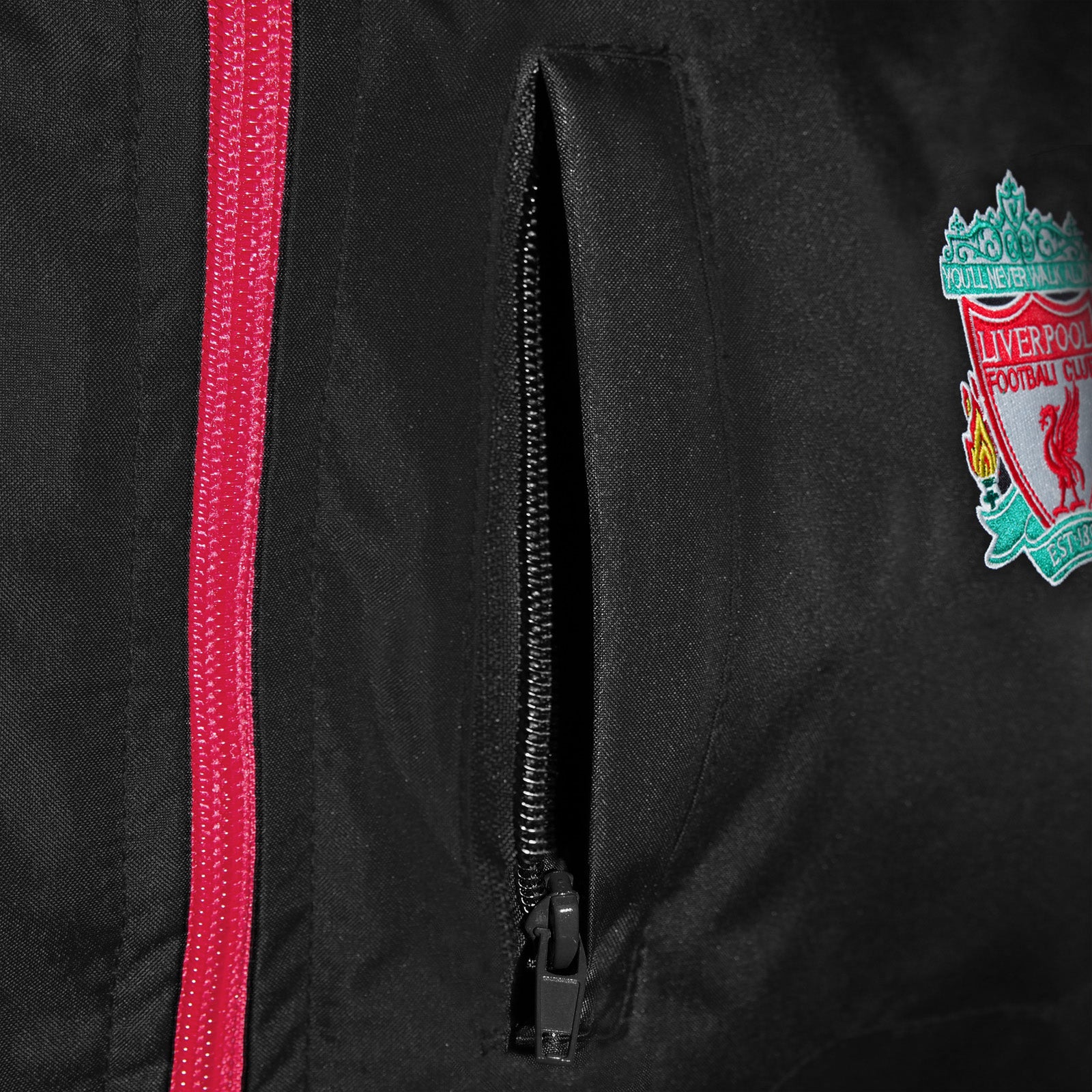 Liverpool adults shower jacket with hood in black with club crest to chest.