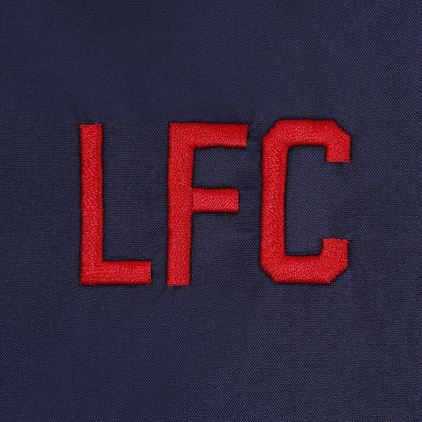 Liverpool kids shower jacket with hood in navy blue with club crest to chest.