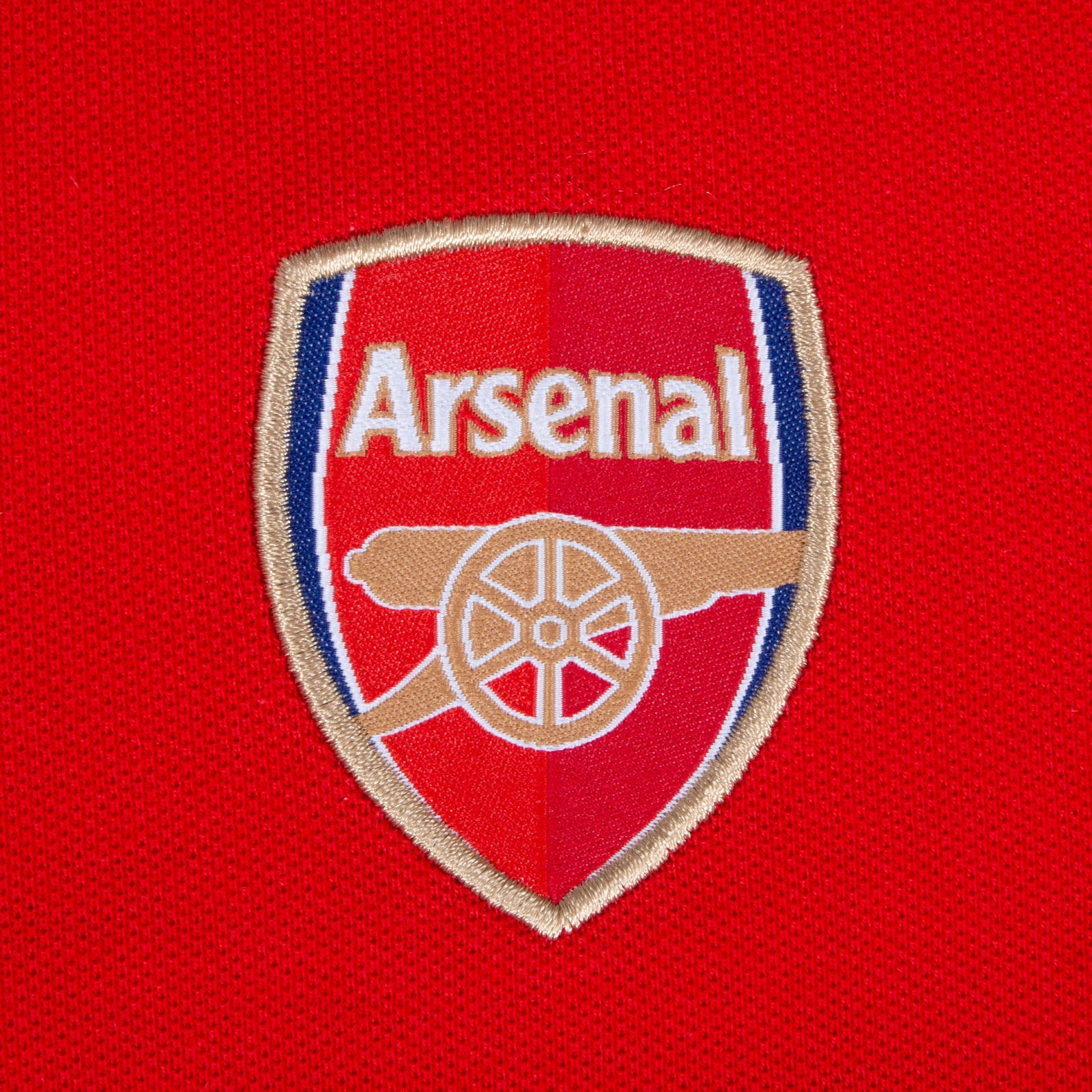 Arsenal polo shirt for kids in red with club crest and canon to chest.