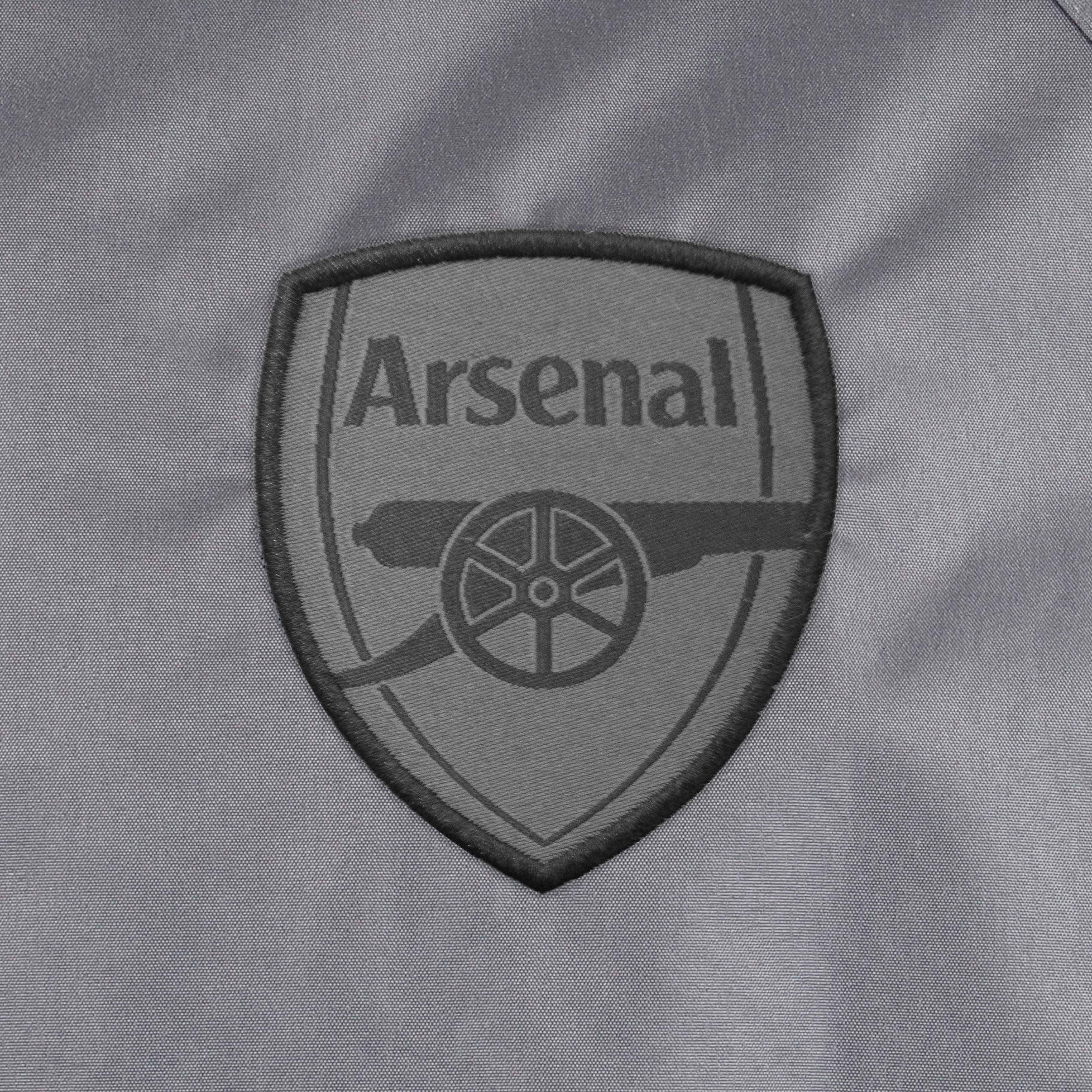 Arsenal adults shower jacket with hood in grey with club crest to chest.