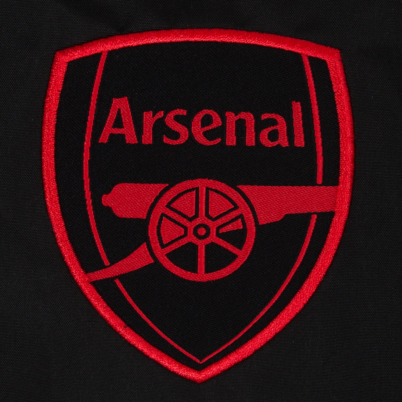 Arsenal adults shower jacket with hood in grey with club crest to chest.