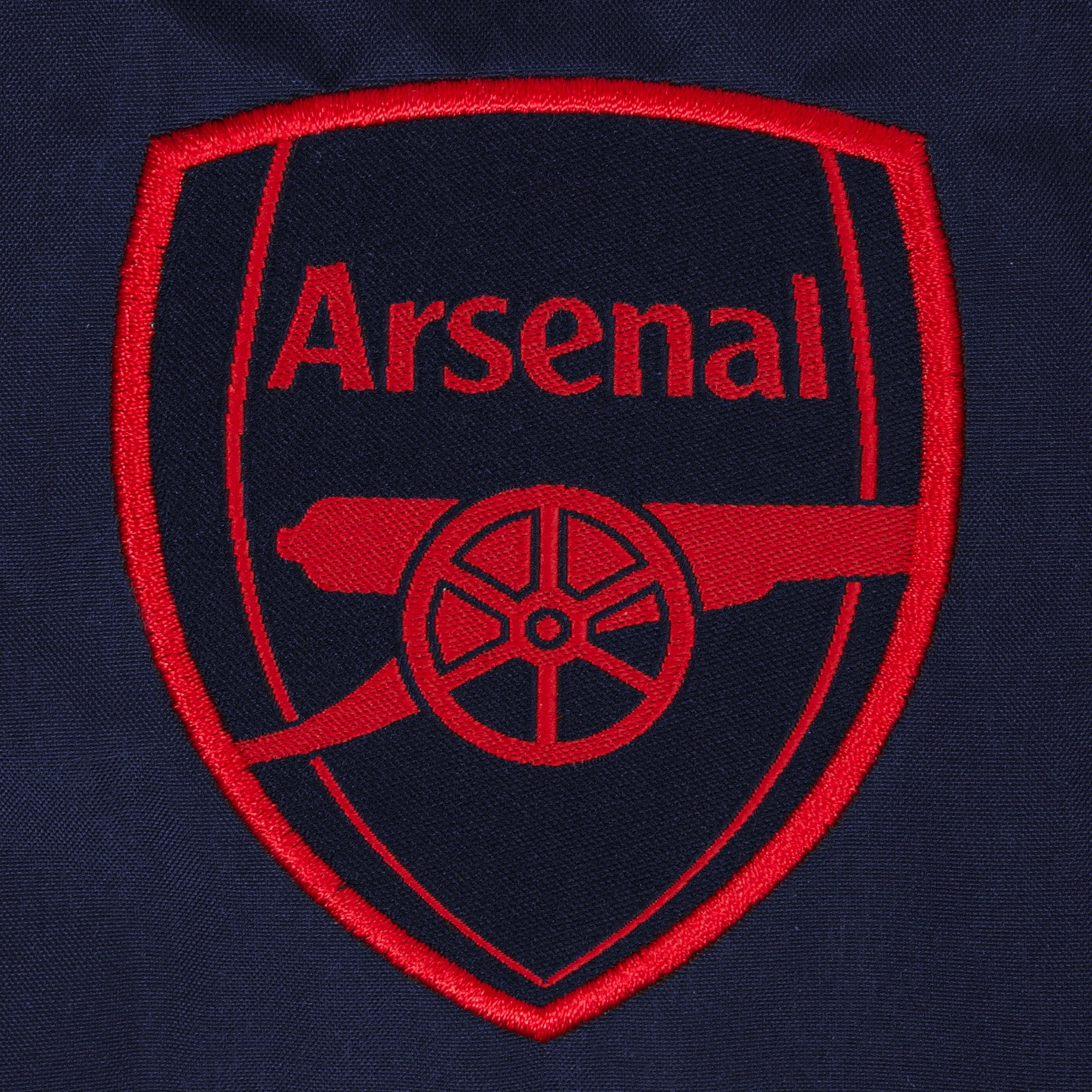 Arsenal adults shower jacket with hood in navy with club crest to chest.