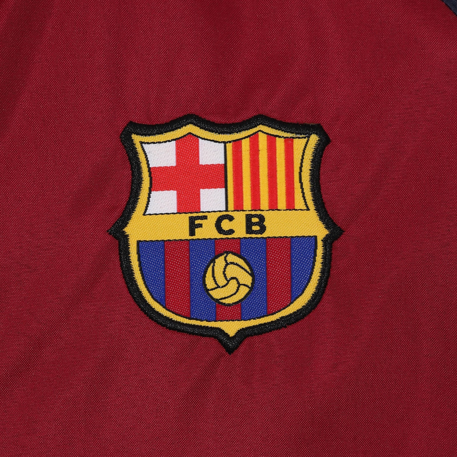 FC Barcelona kids shower jacket in navy & red with a FCB club crest to chest.