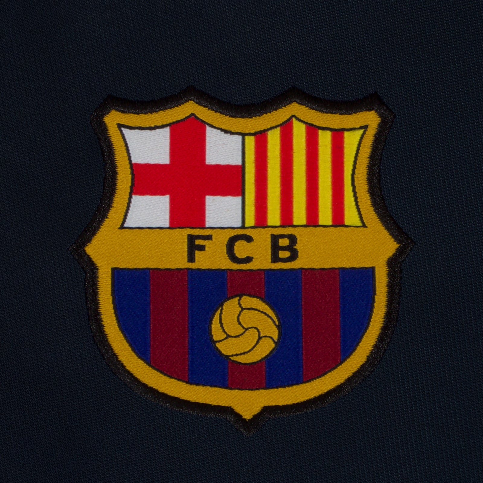 FC Barcelona kids retro track jacket in navy blue with FCB badge to chest.