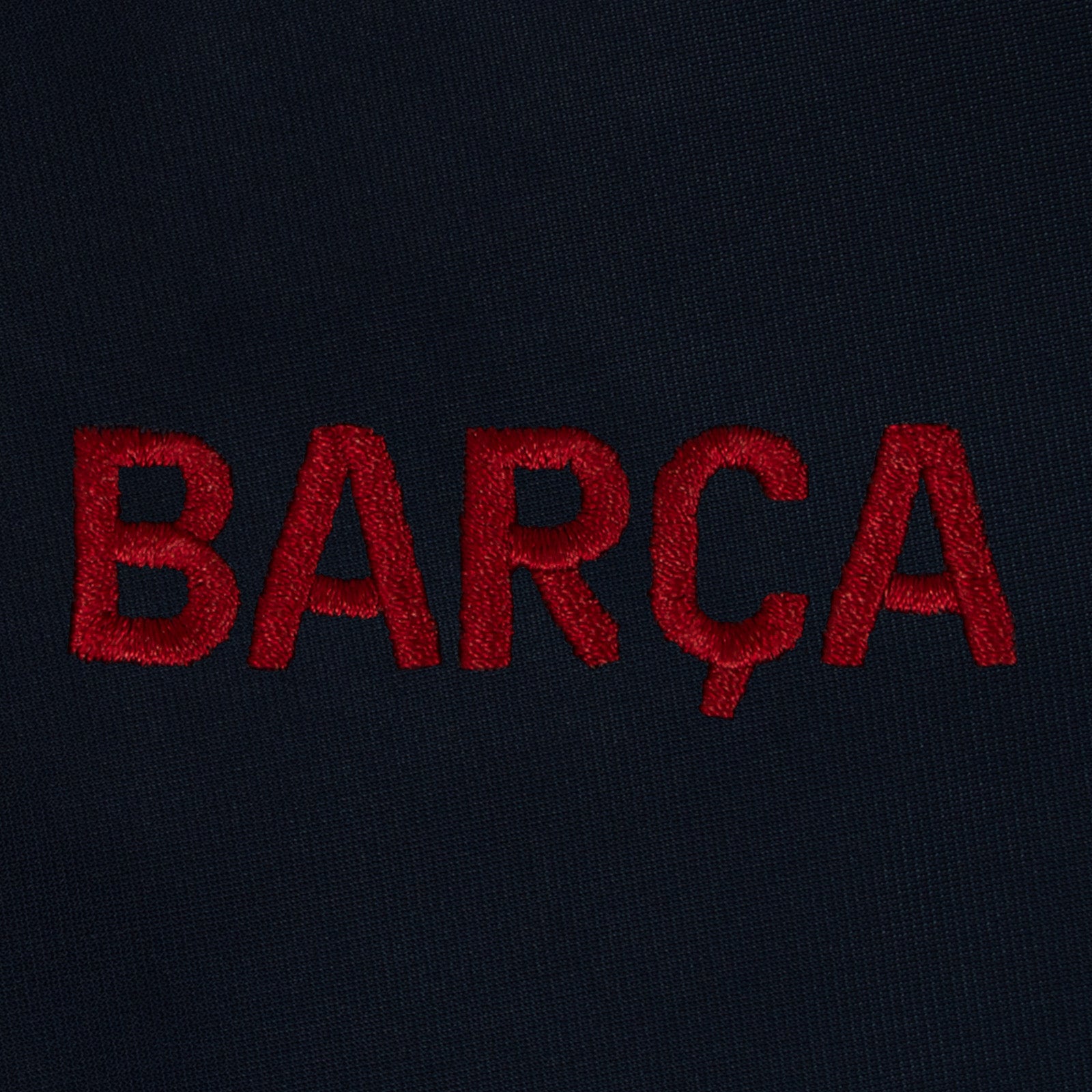 FC Barcelona kids retro track jacket in navy blue with FCB badge to chest.