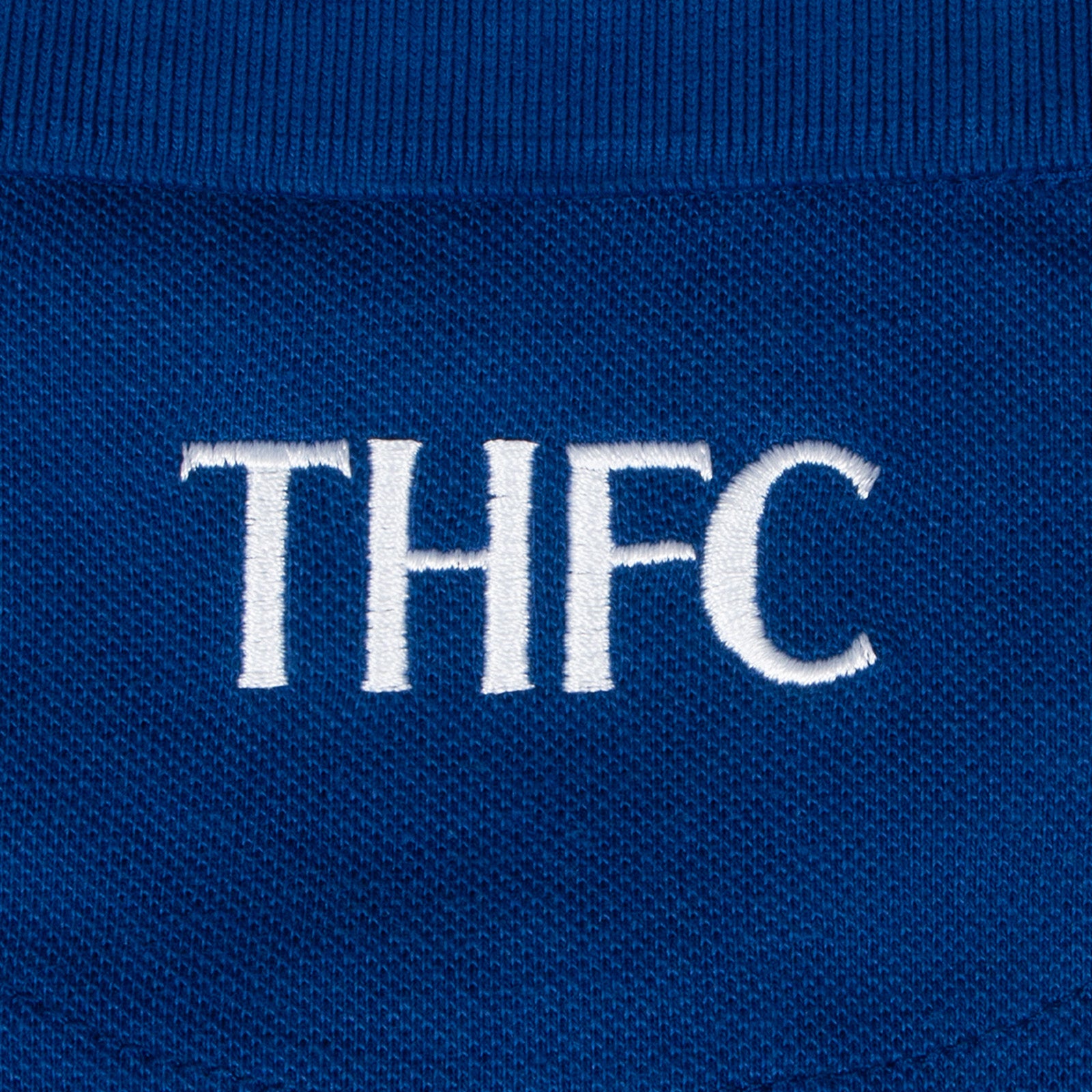 Spurs adults polo shirt in marine with Spurs badge and text to chest.