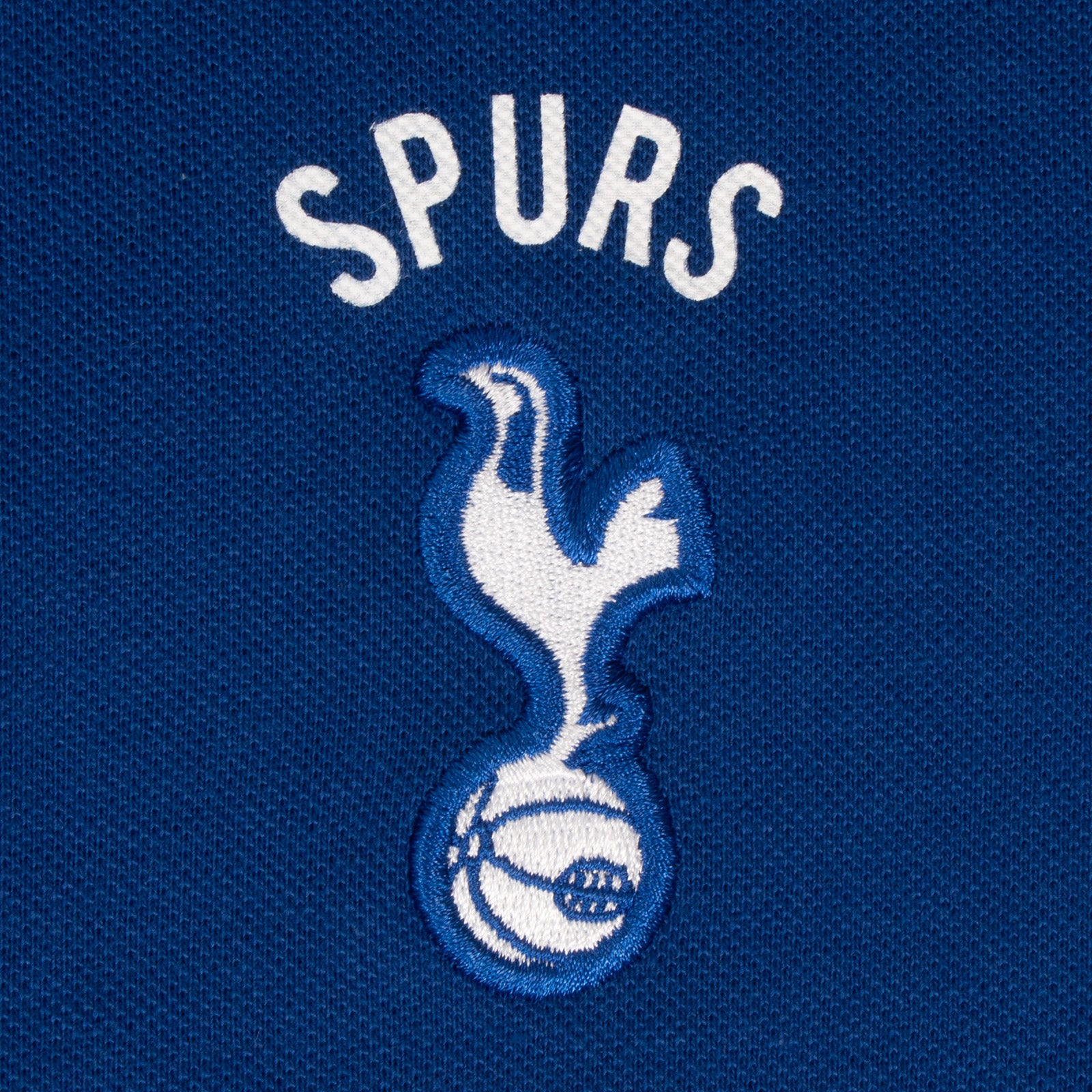 Spurs adults polo shirt in marine with Spurs badge and text to chest.