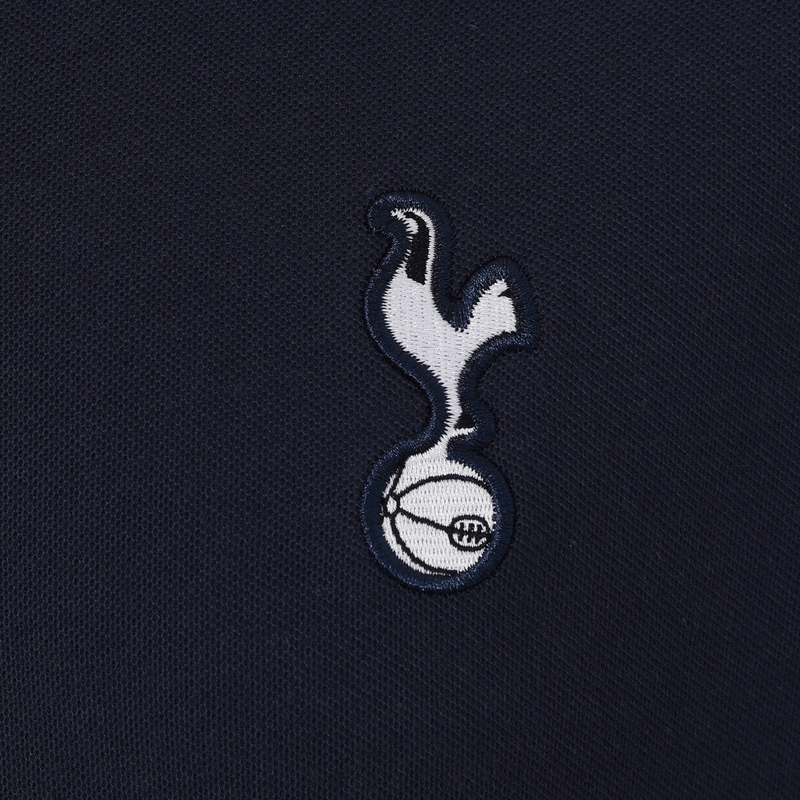 Spurs adults polo shirt in navy blue with contrast sleeve and Spurs badge and text to chest.