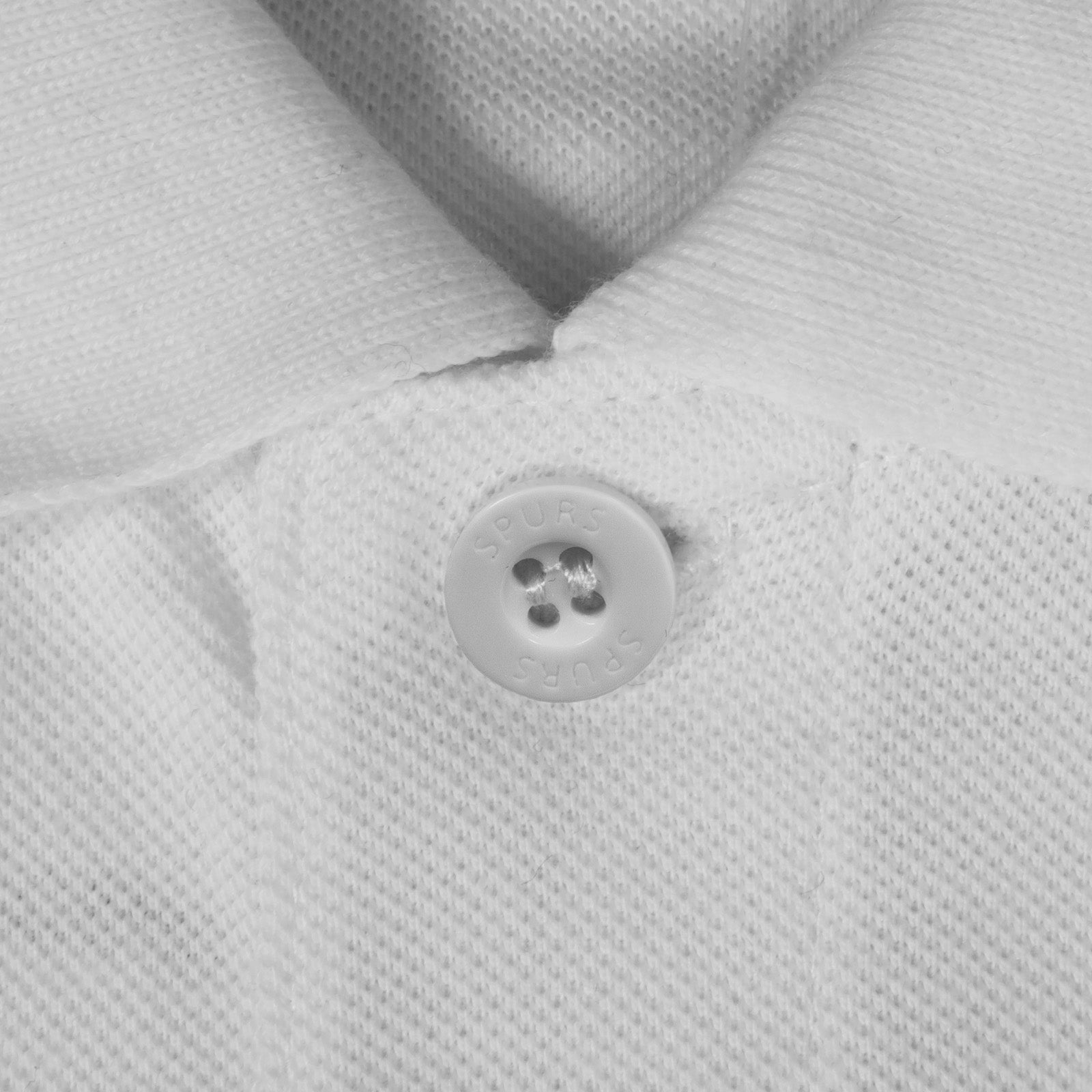 Spurs adults polo shirt in white with Spurs badge and text to chest.