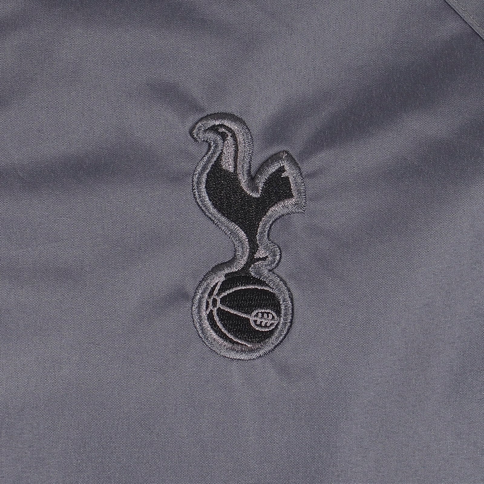 Spurs adults hooded shower jacket in grey with club crest to the chest.