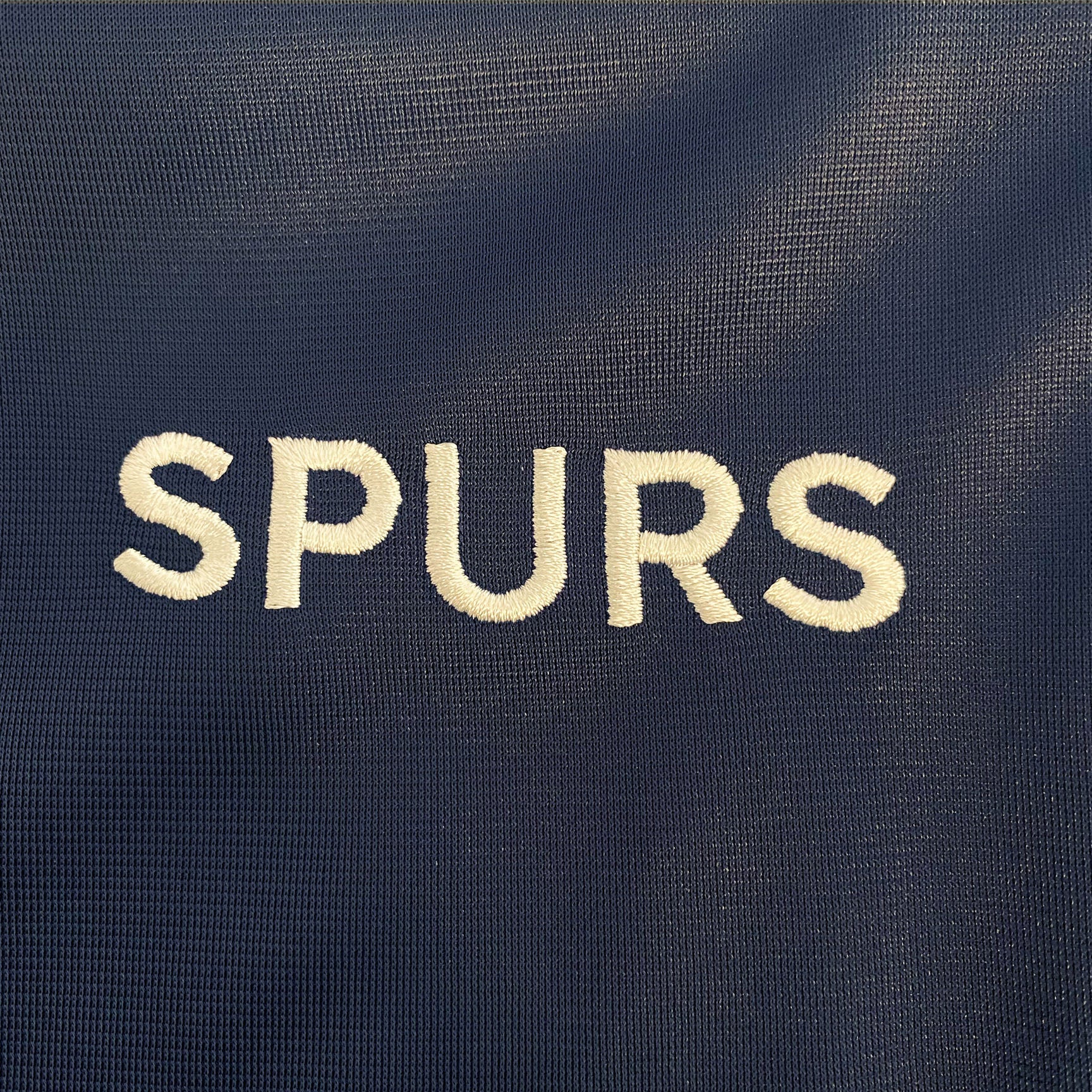 Spurs kids retro track jacket in navy blue with club crest to chest.