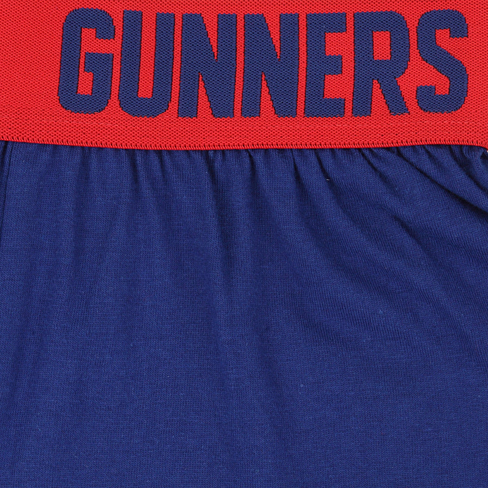 Arsenal kids pyjamas. Short sleeve top in red with branded graphic and pyjama shorts in blue with AFC logo to the left leg