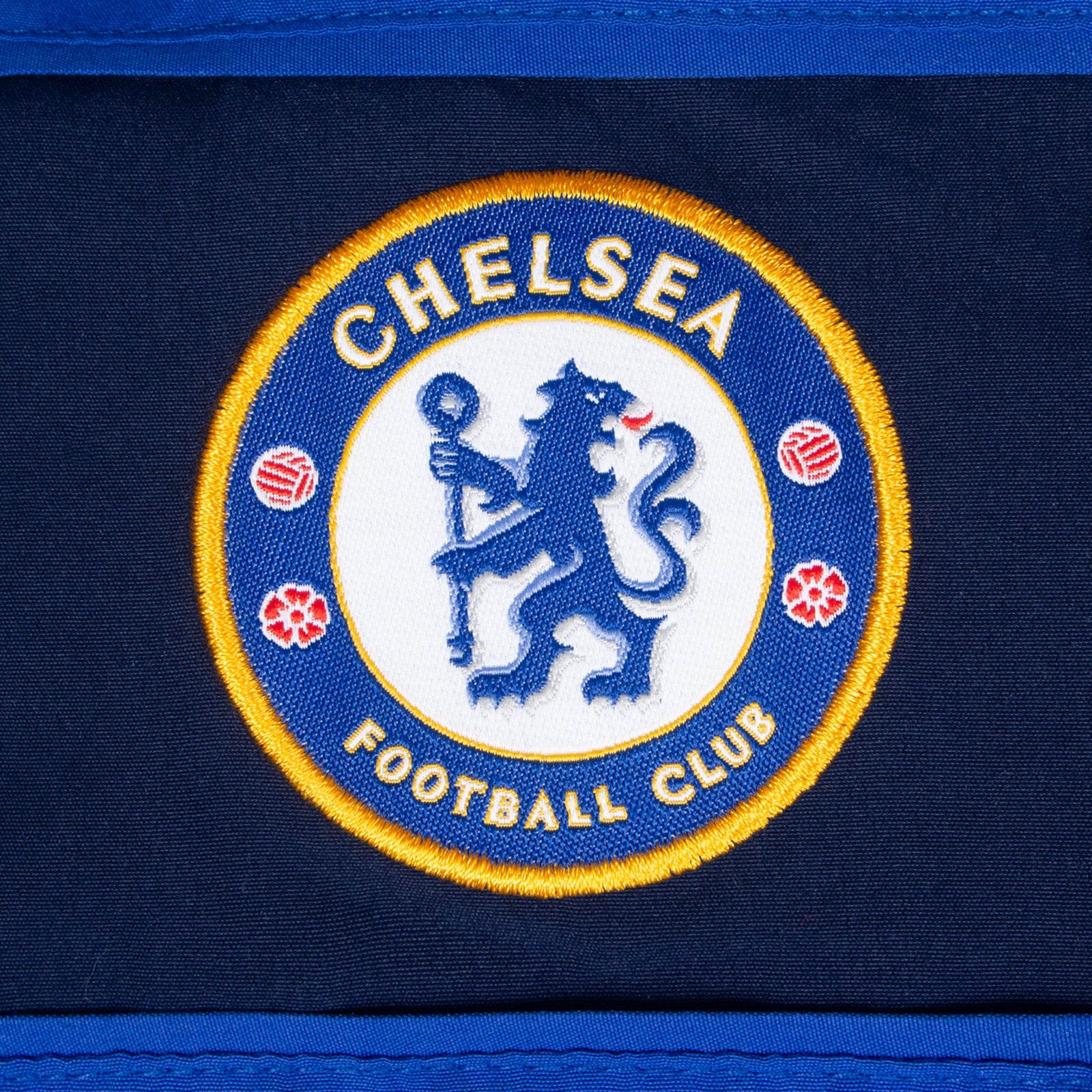 Chelsea kids tracksuit in royal blue with club crest to chest and left thigh