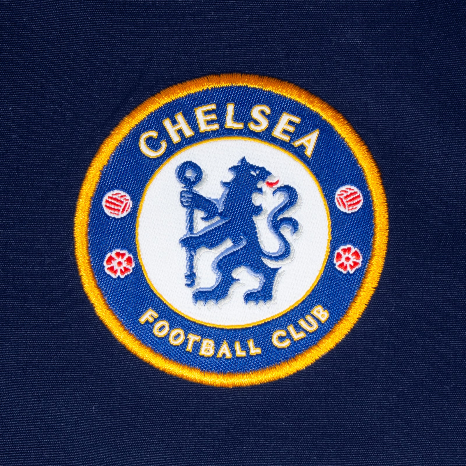 Chelsea kids tracksuit in royal blue with club crest to chest and left thigh