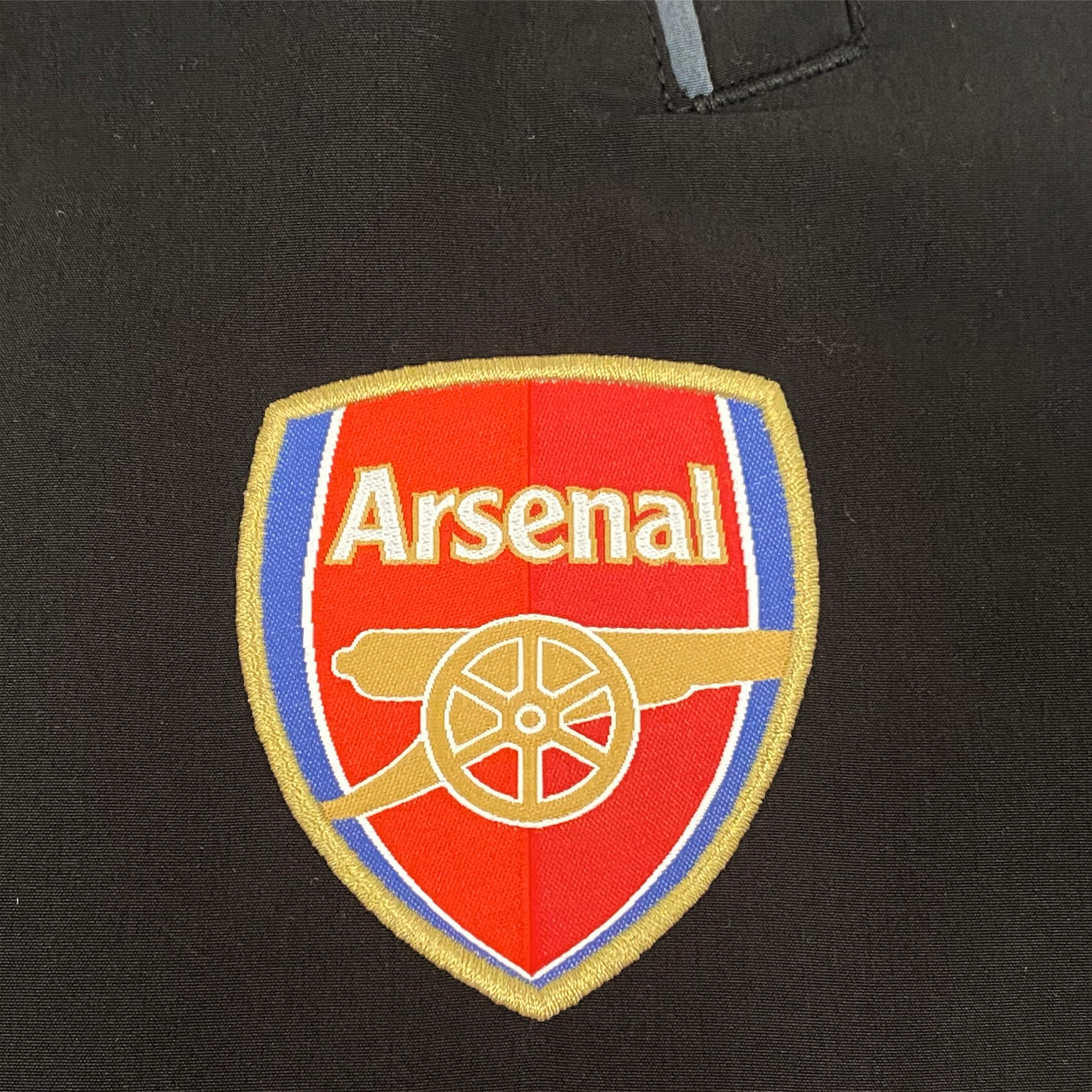 Arsenal adults tracksuit in black & grey with club crest to chest and left thigh