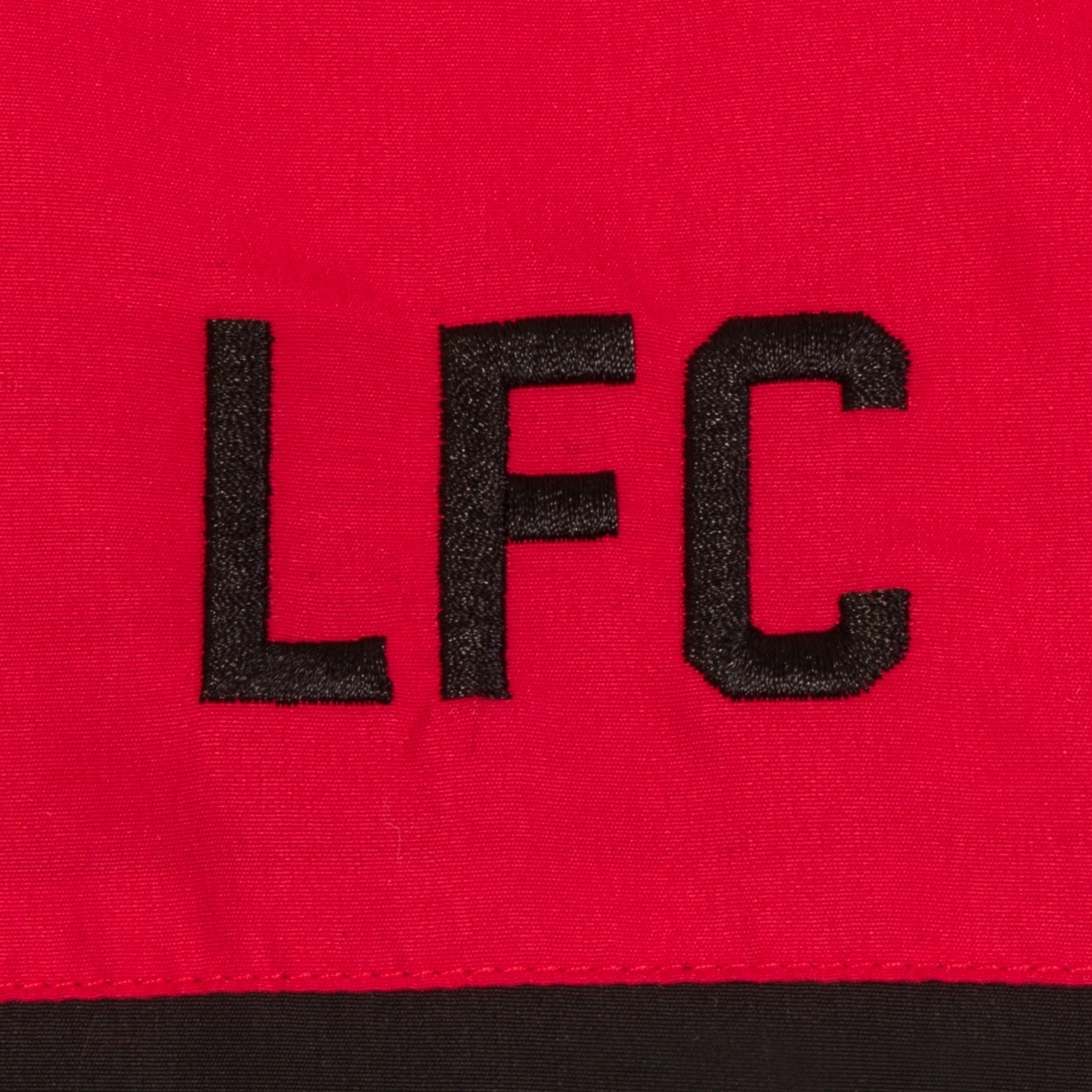 Liverpool kids tracksuit in red with club crest to chest and left thigh