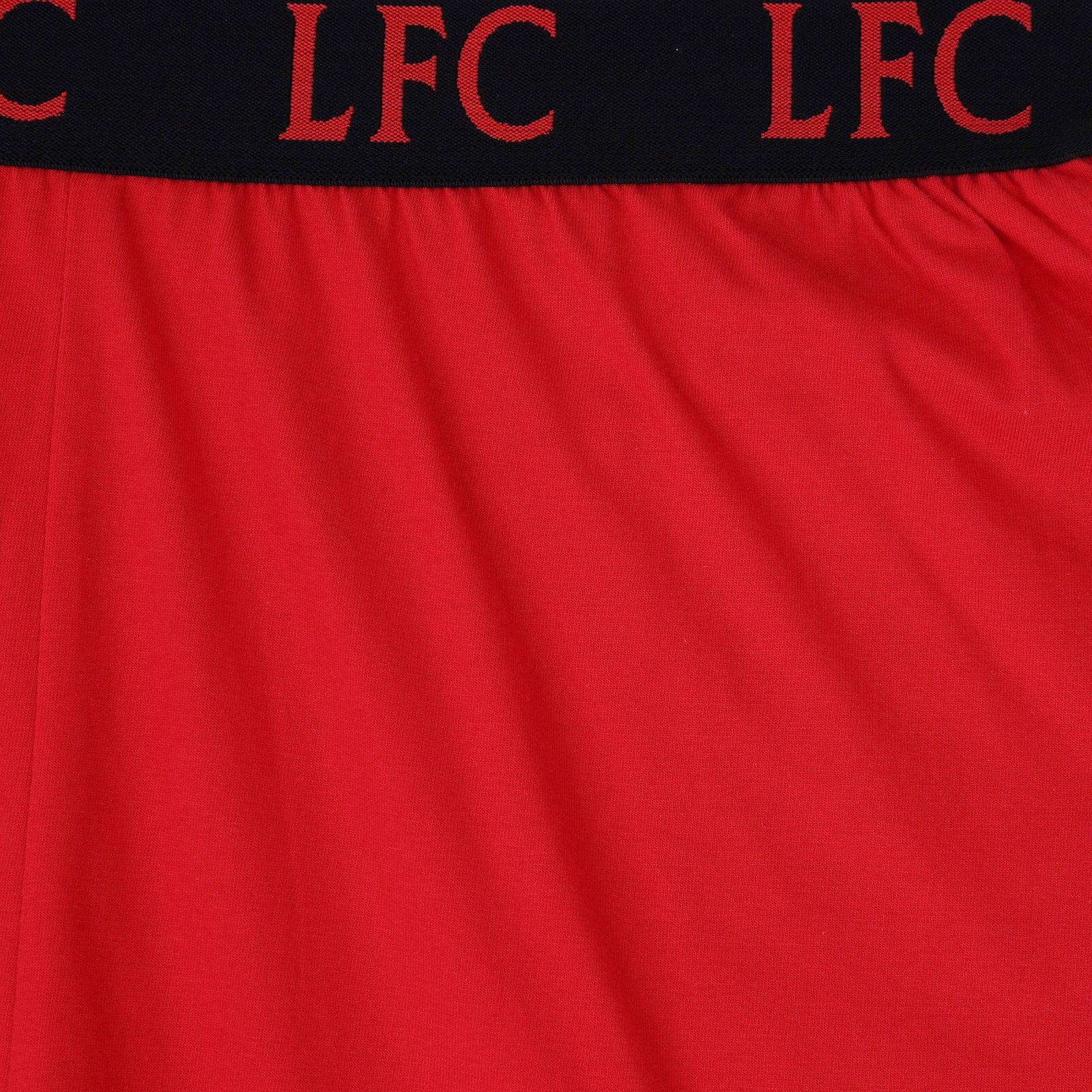 Liverpool adults pyjamas in red. Short sleeve top with graphic and shorts with logo to the left leg.