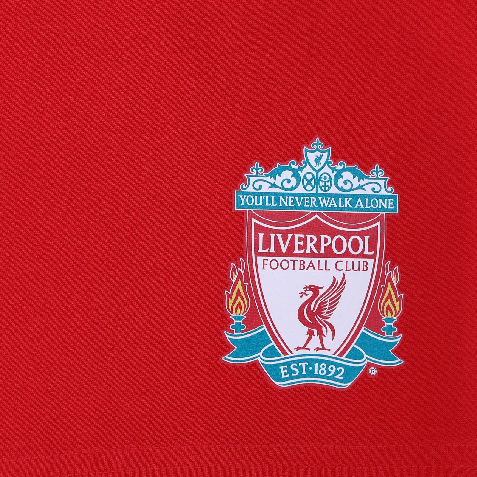 Liverpool adults pyjamas in red. Short sleeve top with graphic and shorts with logo to the left leg.