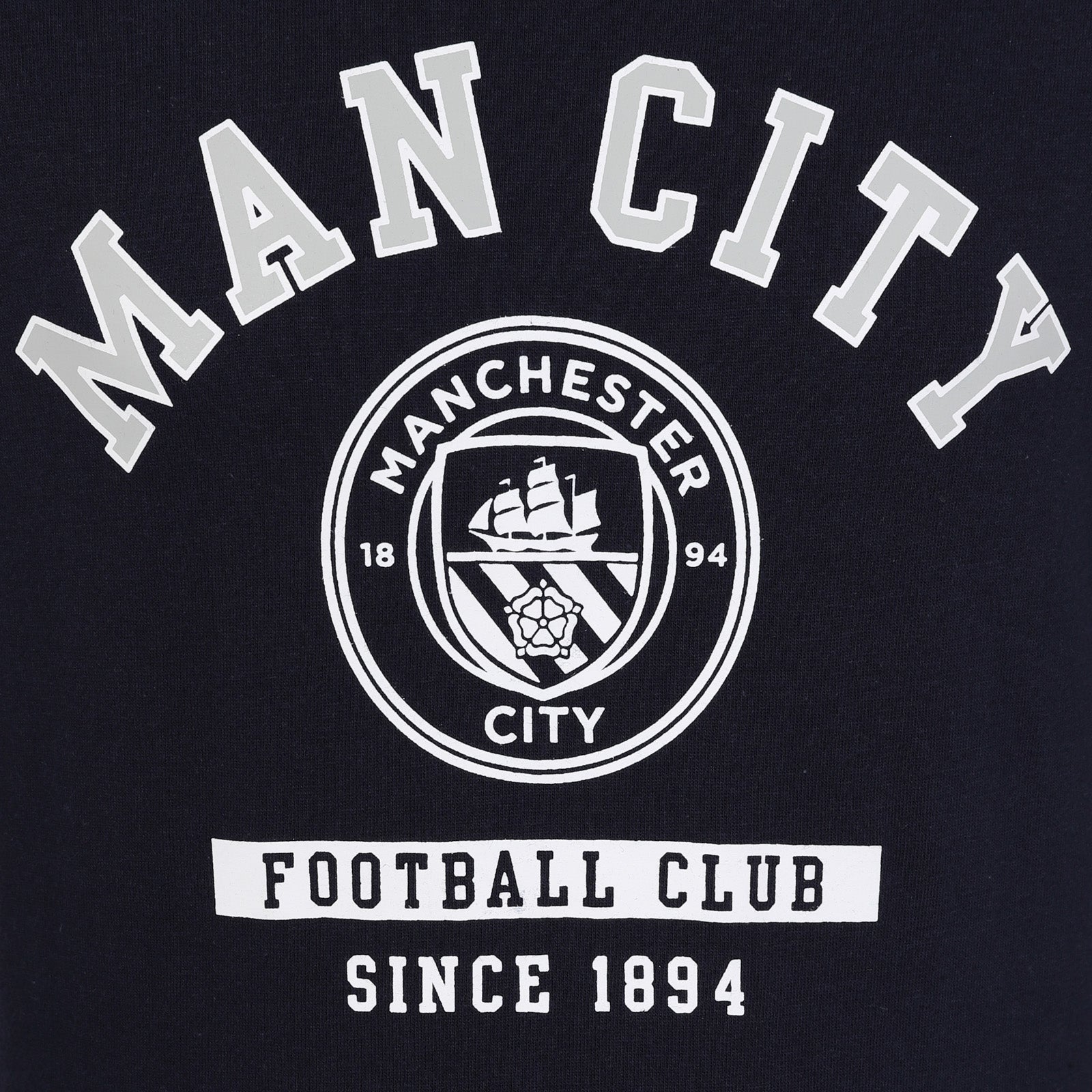 Man City kids long sleeve T-shirt in navy blue with large club crest print to front.