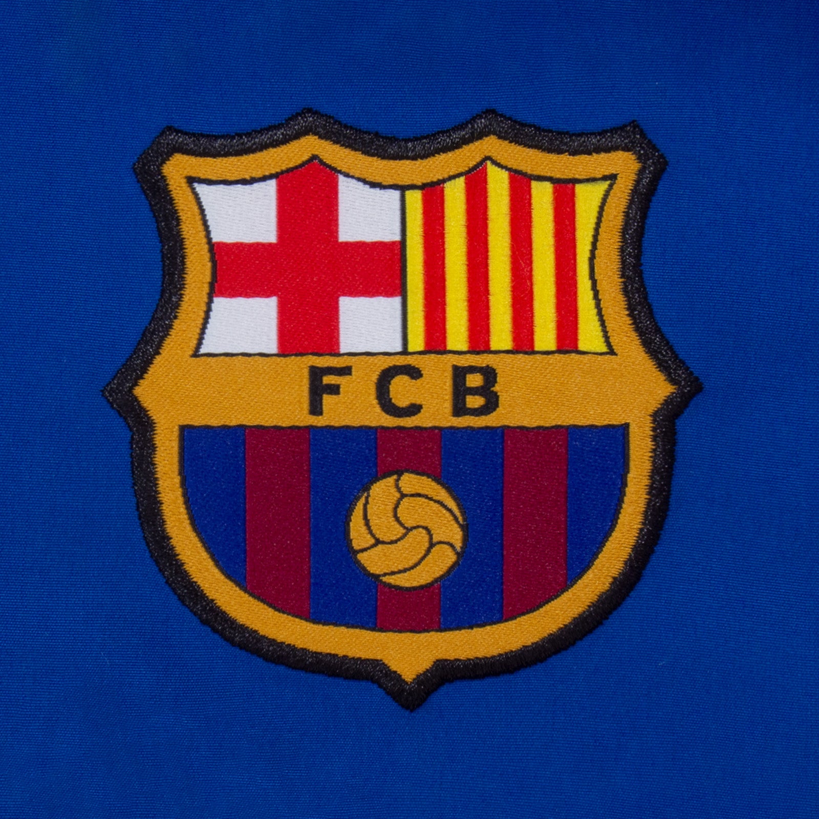 FC Barcelona kids tracksuit in reflex blue with club crest to chest and left thigh