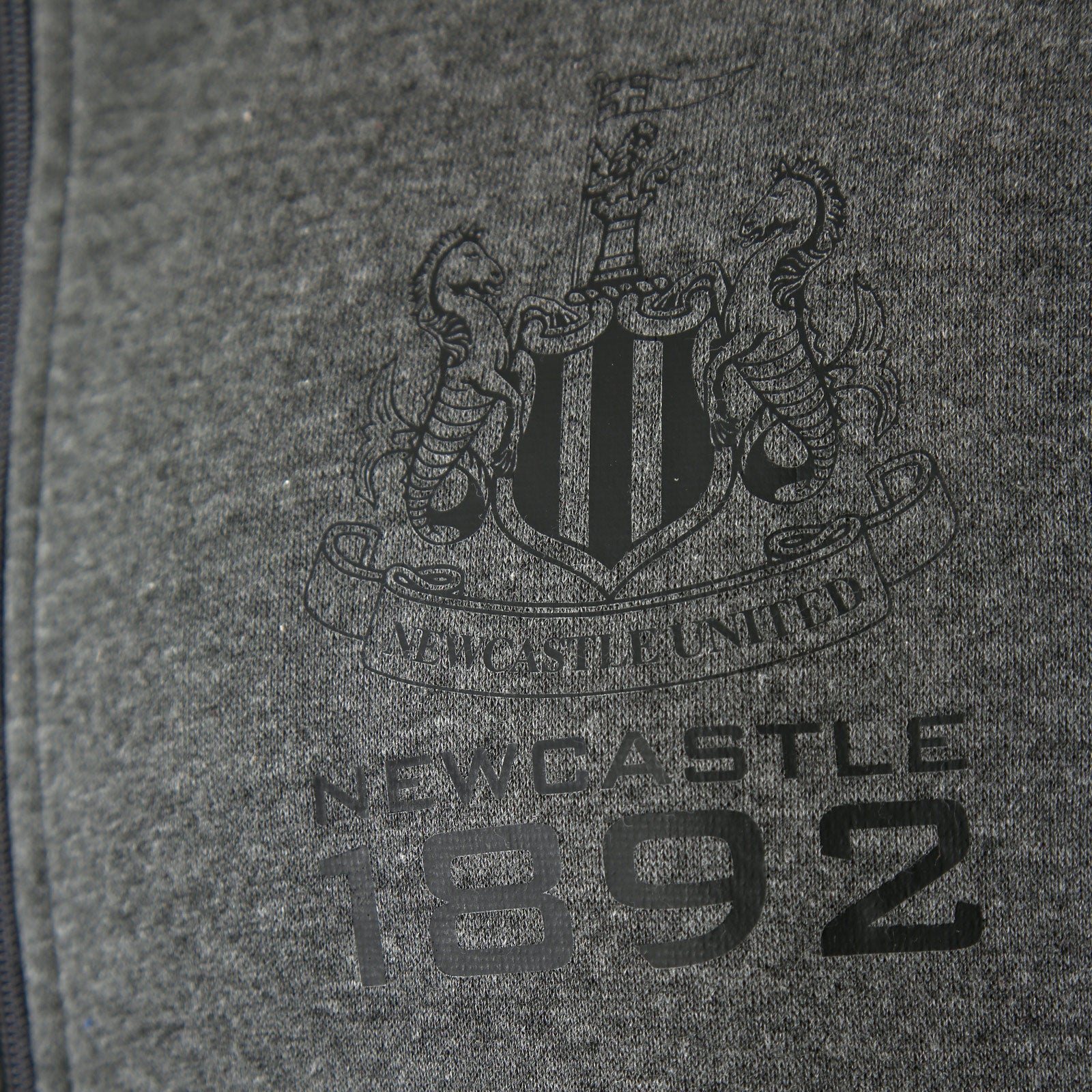 Newcastle United adults zip hoodie in grey with club crest on the left chest.