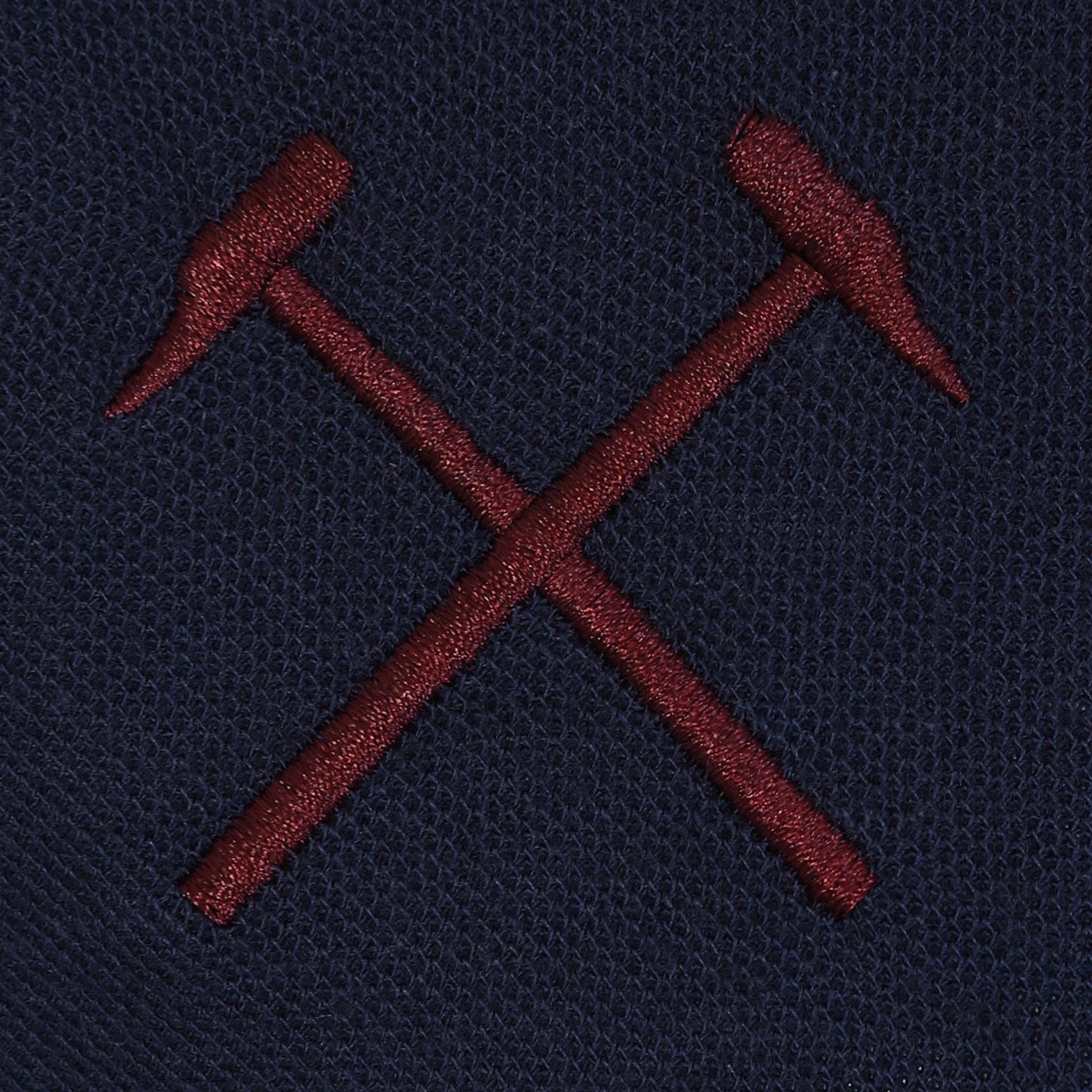 West Ham adults polo shirt in navy with WHUFC badge and text to chest.