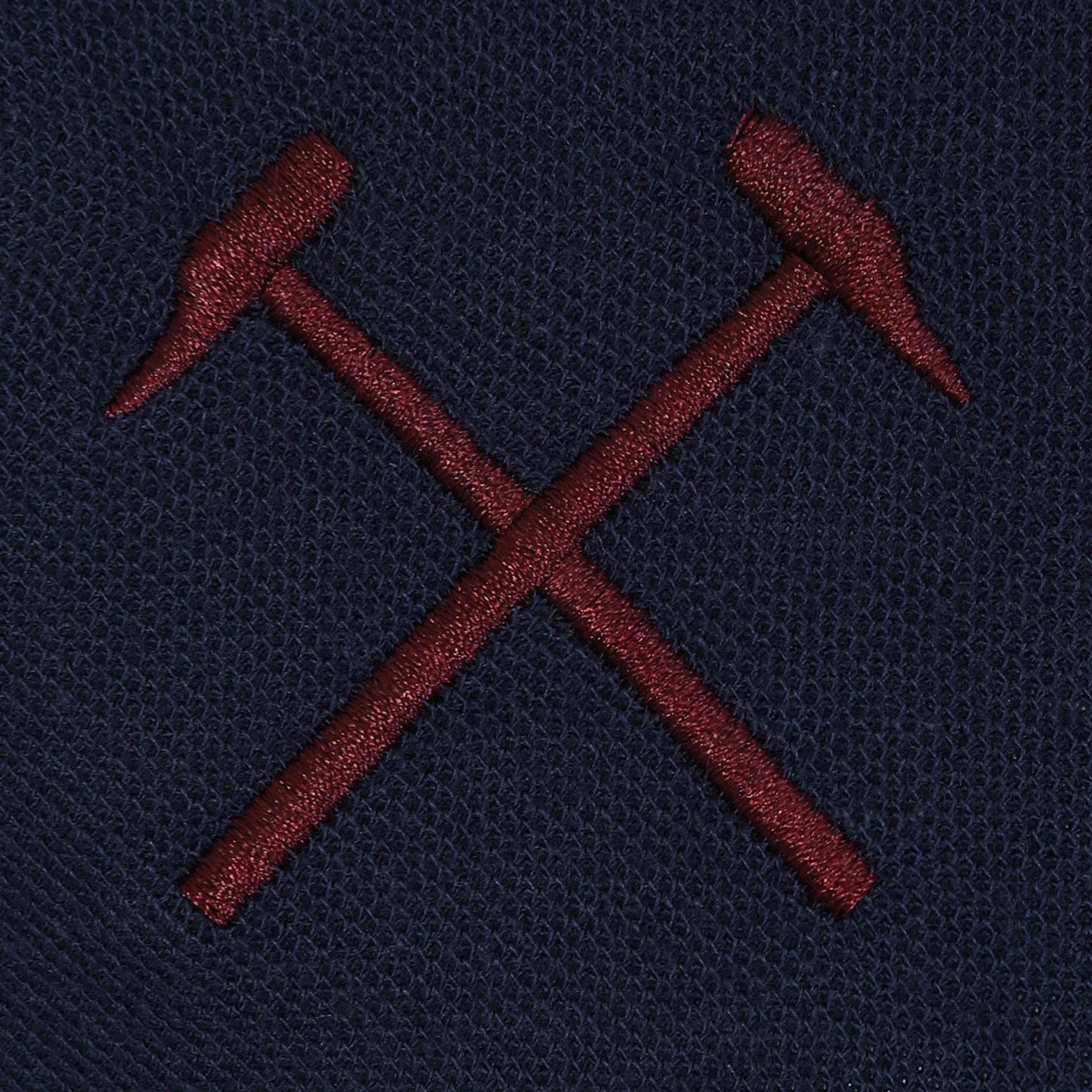 West Ham adults polo shirt in navy with WHUFC badge and text to chest.
