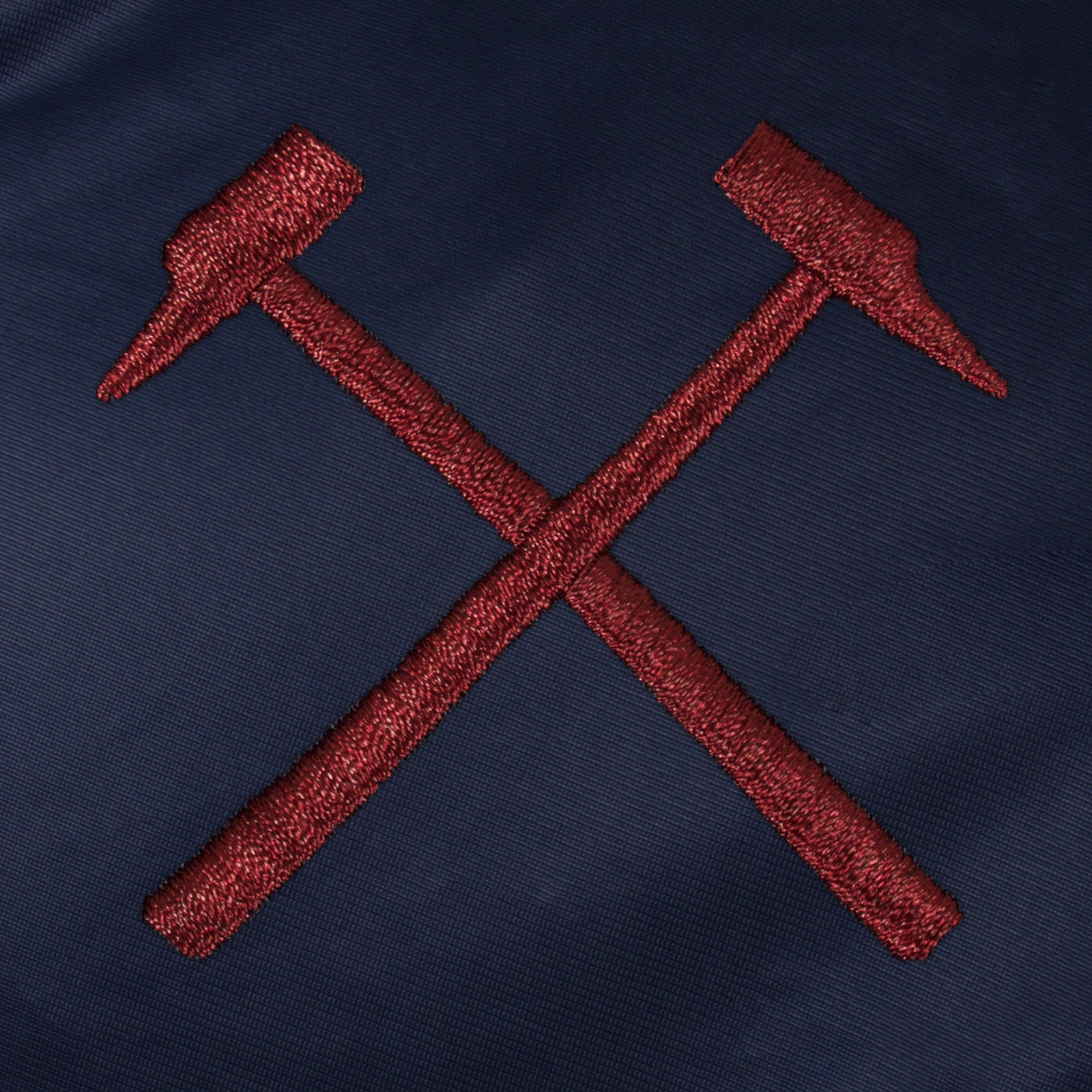 West Ham adults retro track jacket in navy blue with club crest to chest.