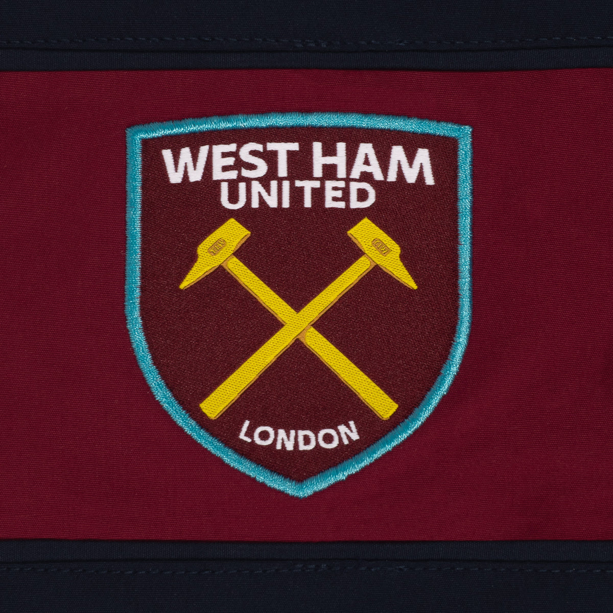 West Ham adults tracksuit in navy blue with club crest to chest and left thigh