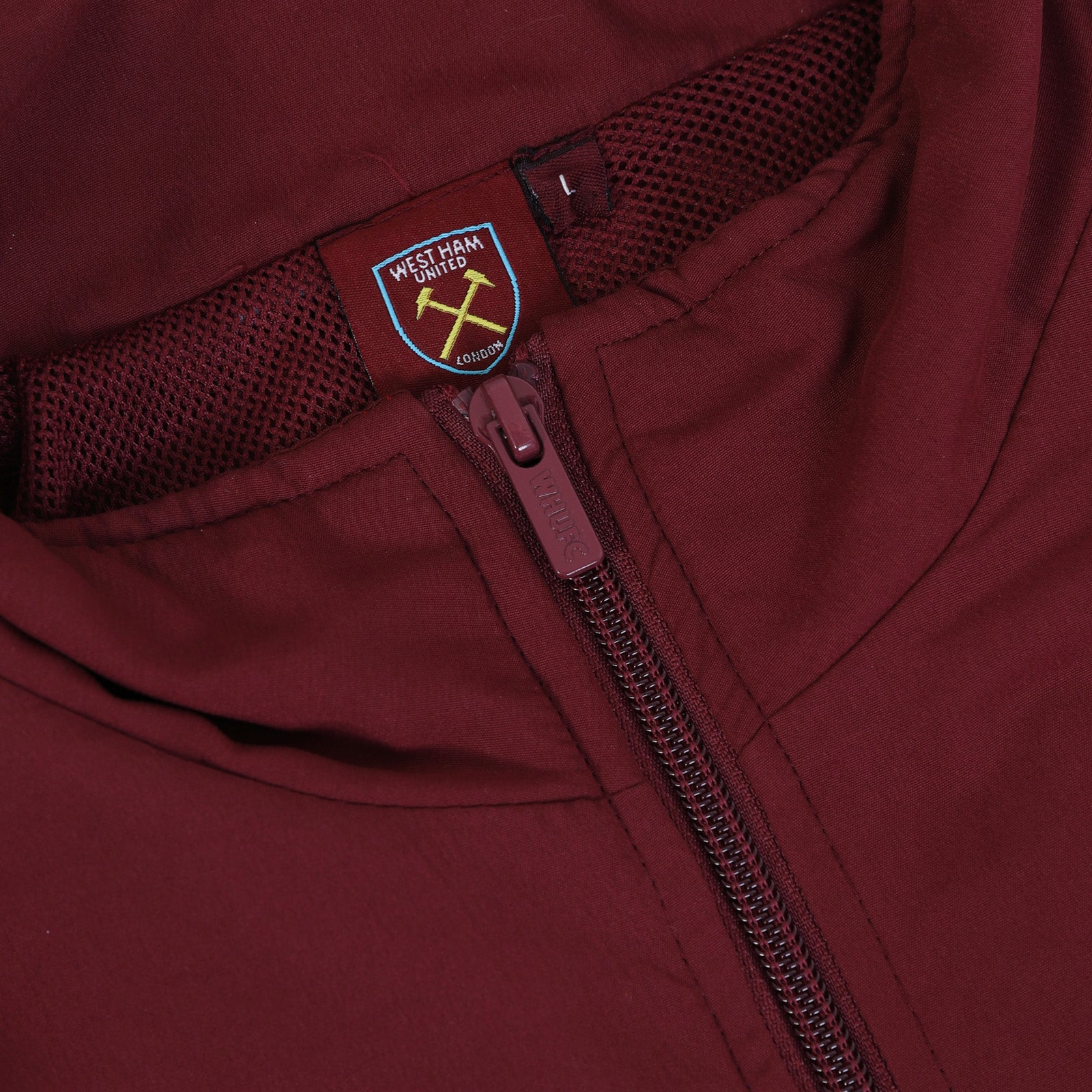 West Ham adults tracksuit in navy blue with club crest to chest and left thigh