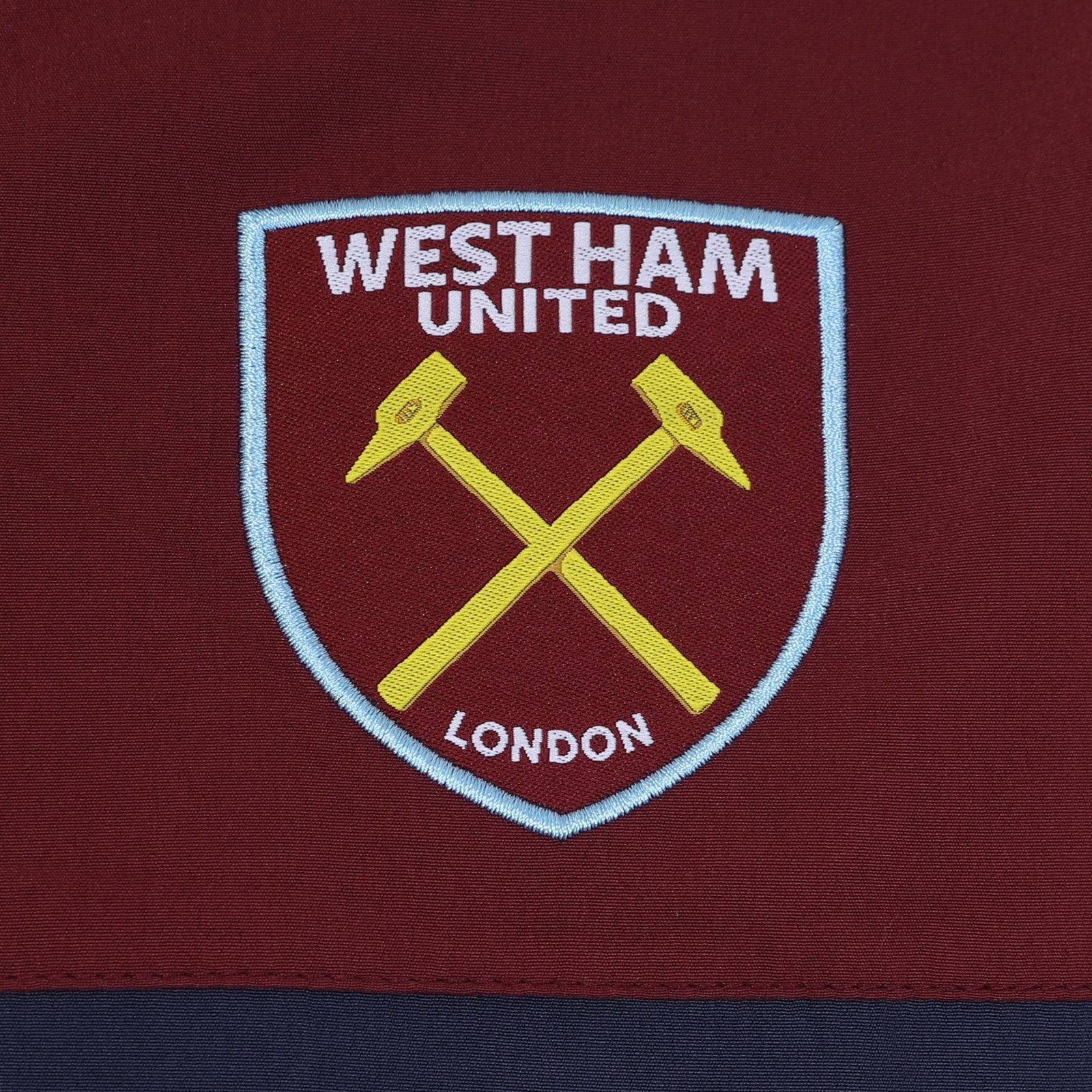 West Ham adults tracksuit in navy blue with club crest to chest and left thigh